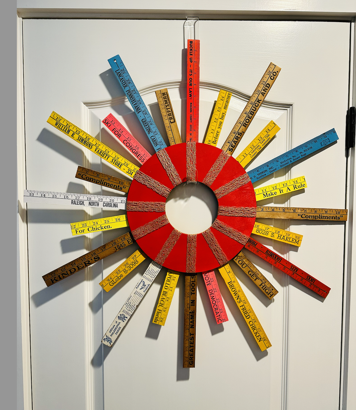 AVAILABLE.
"Rulers of the Free World Wreath" To be exhibited at The Old Sculpin Gallery, Dec 8 & 9, for the Christmas in Edgartown show.
Wooden disc, assorted vintage rulers and yardsticks, metallic ribbon.
Appearing at The Old Sculpin Gallery for