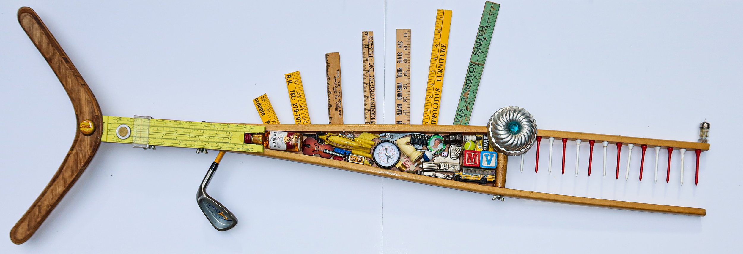 SOLD; Found Fish #10
SOLD. Wooden crutch, vacuum tube, jello mold, slide rule, vintage boomerang, old yardsticks, golf club, toys, wooden blocks, mini scotch bottle, toy cello.
48"W X 18"T X 3"D.