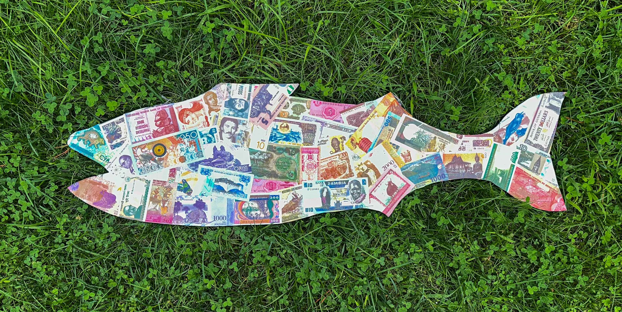 AVAILABLE: My 2025 Bass in The Grass creation; "This Bass is In The Money!". 12" X 42" X 1", Double-sided.
This bass has paper money from 47 countries on one side and coins from 113 countries on the other side, with a total of 142 countries represen