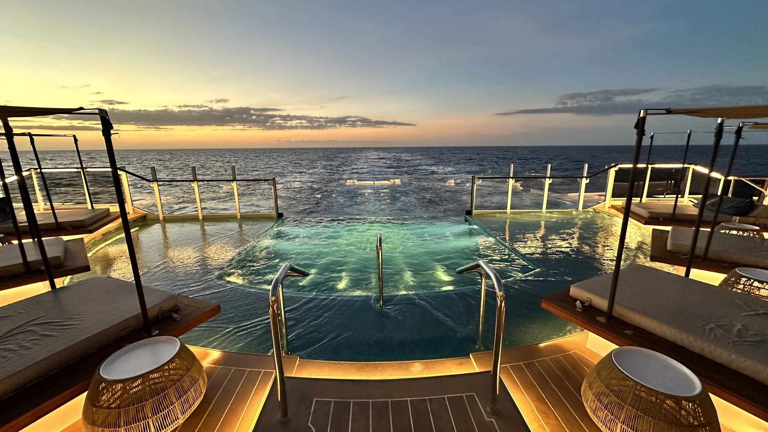 Astern Pool aboard Explora Journeys with infinity edge over the ship's wake.