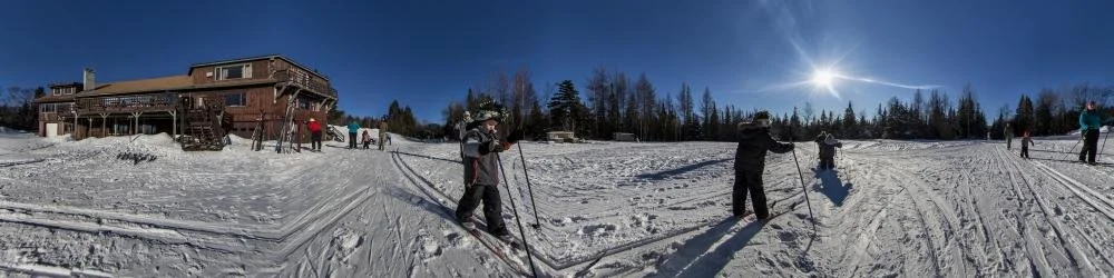 Young person cross country skiing.