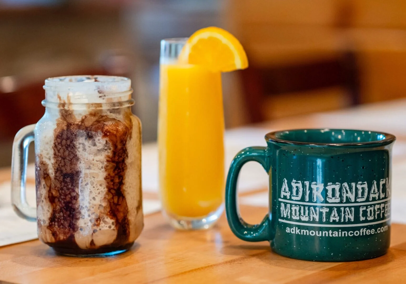 Two coffee drinks and a mimosa.