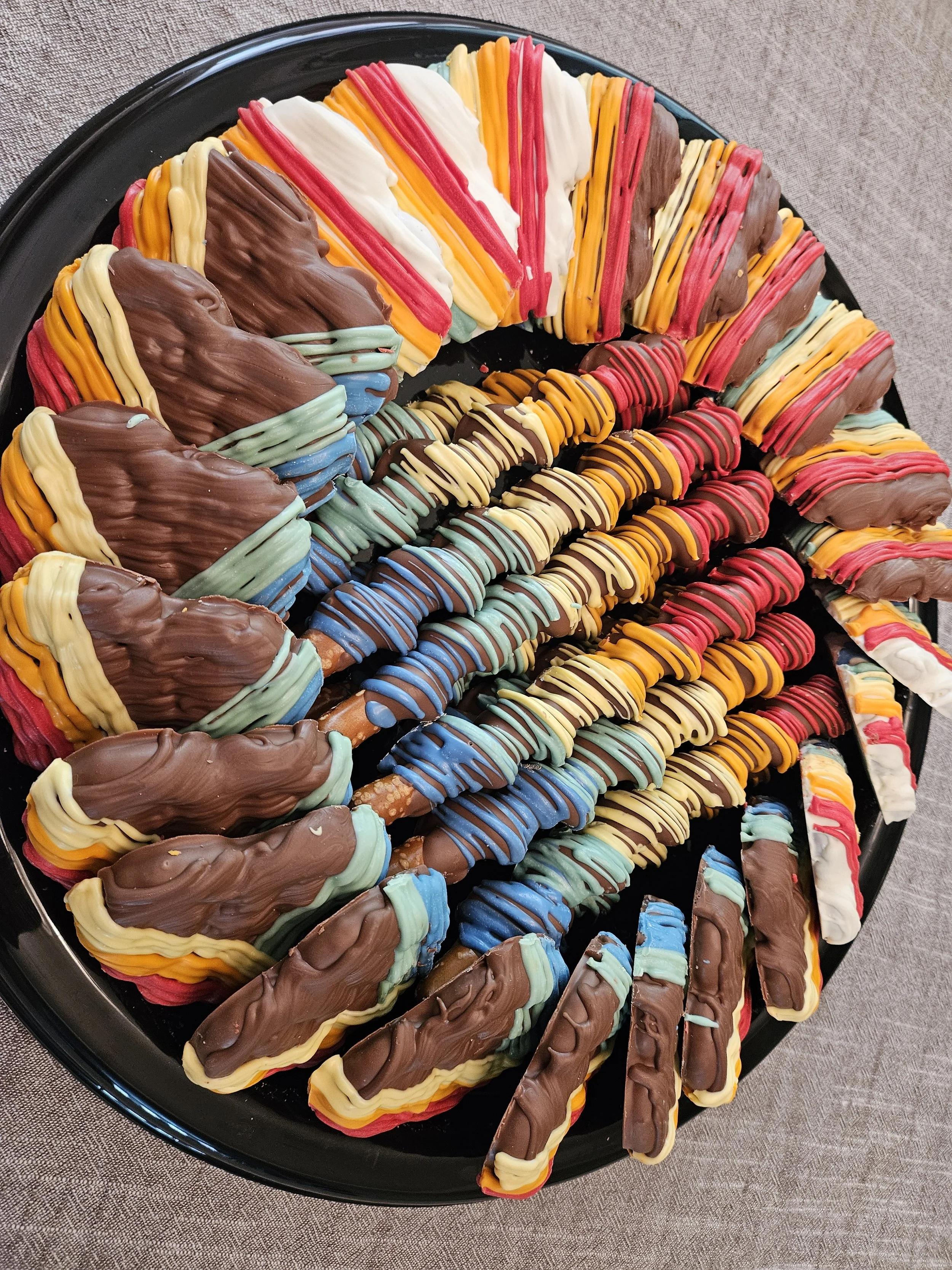 Easter-themed treat boxes, with bunny cutout windows filled with an assortment of easter treats like blondies, chocolate-covered oreos and nutter butters and chocolate stuffed pretzels.