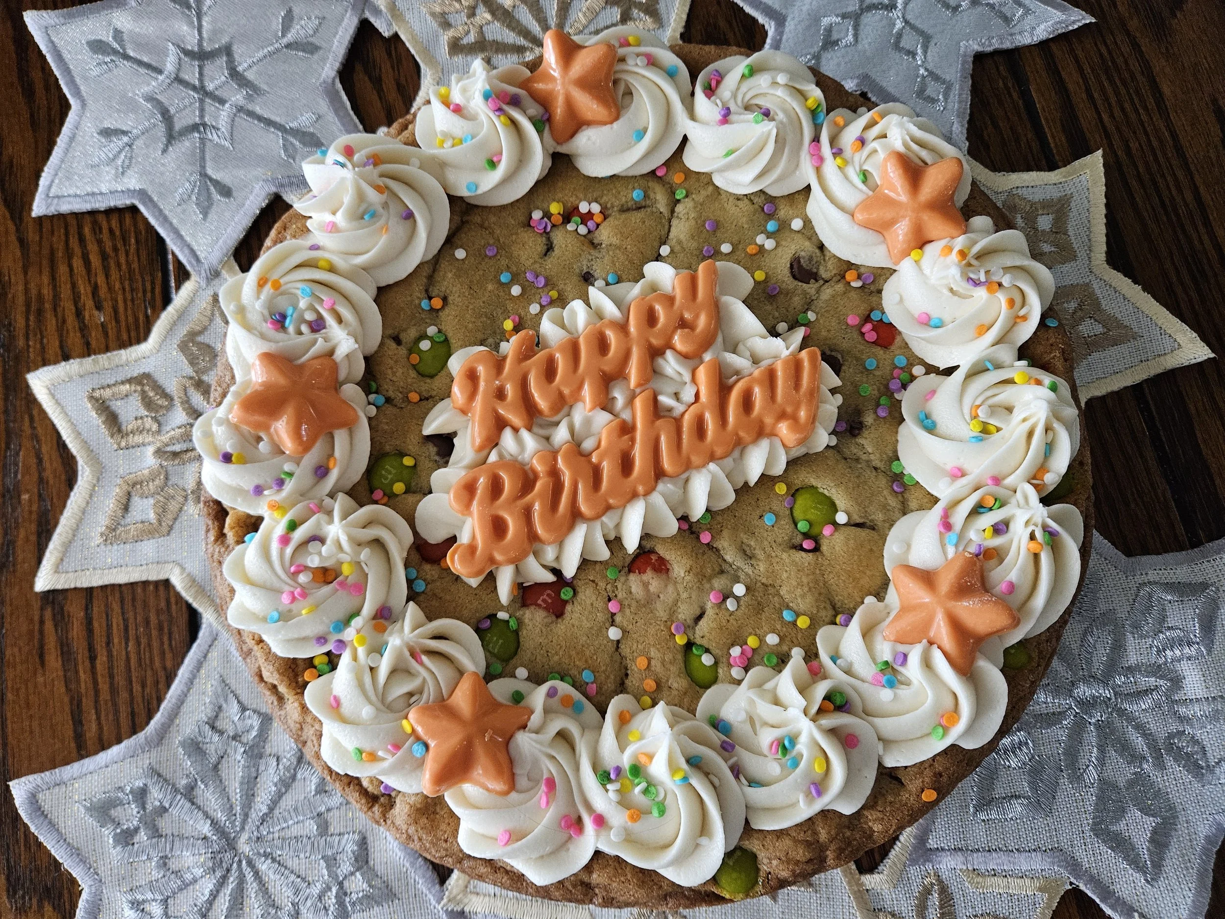 Chocolate cake with chocolate malted icing and topped with colorful candy-coated chocolate malt eggs and sprinkles.
