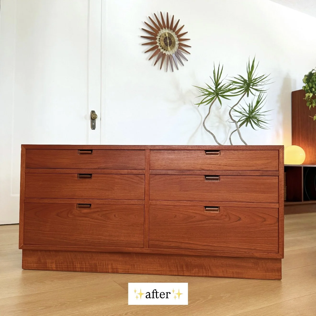 A wooden sideboard with six drawers in a mid-century modern style, in a room with white walls, a decorative wall clock, a potted plant, and a lamp. The word 'after' with star emojis is overlaid at the bottom.