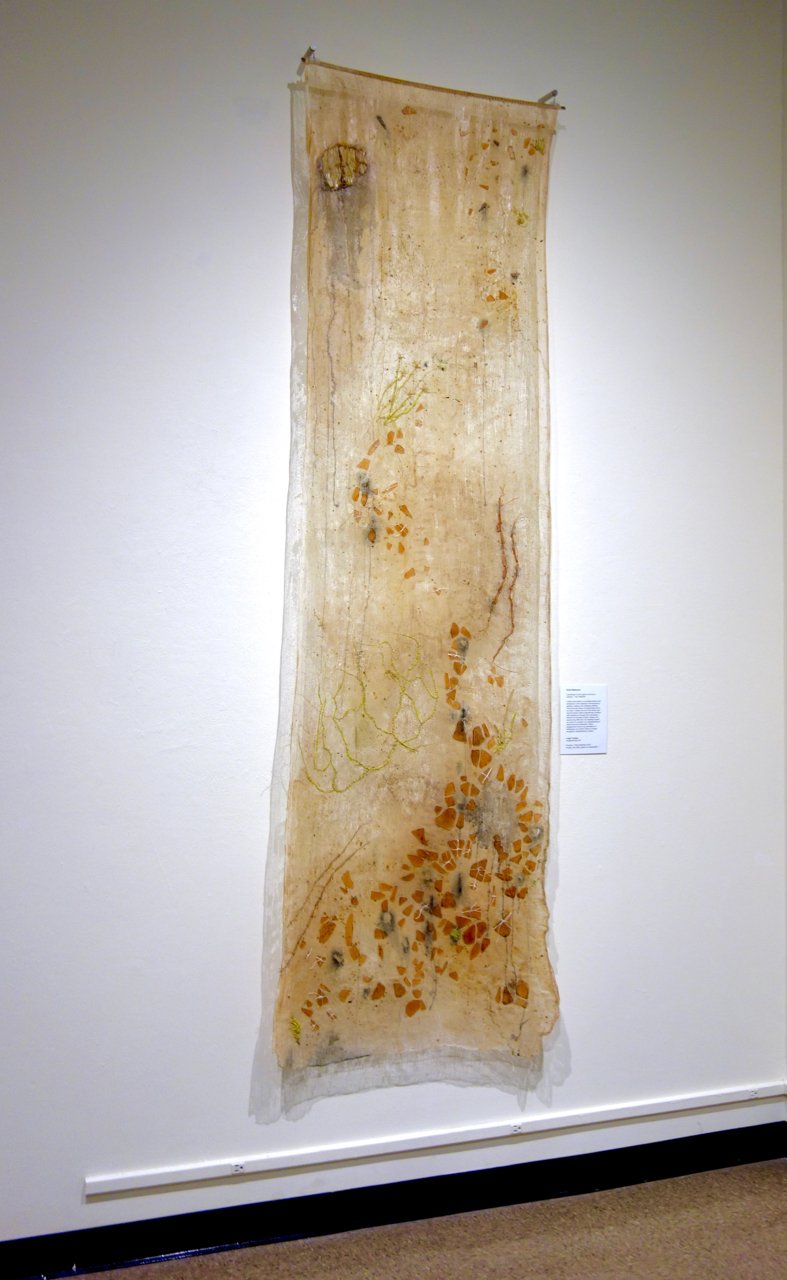 Camino a Tierra Bendita-Cheesecloth acrylic glass, beads, reed soil. 90x30x3" © Leigh Yardley