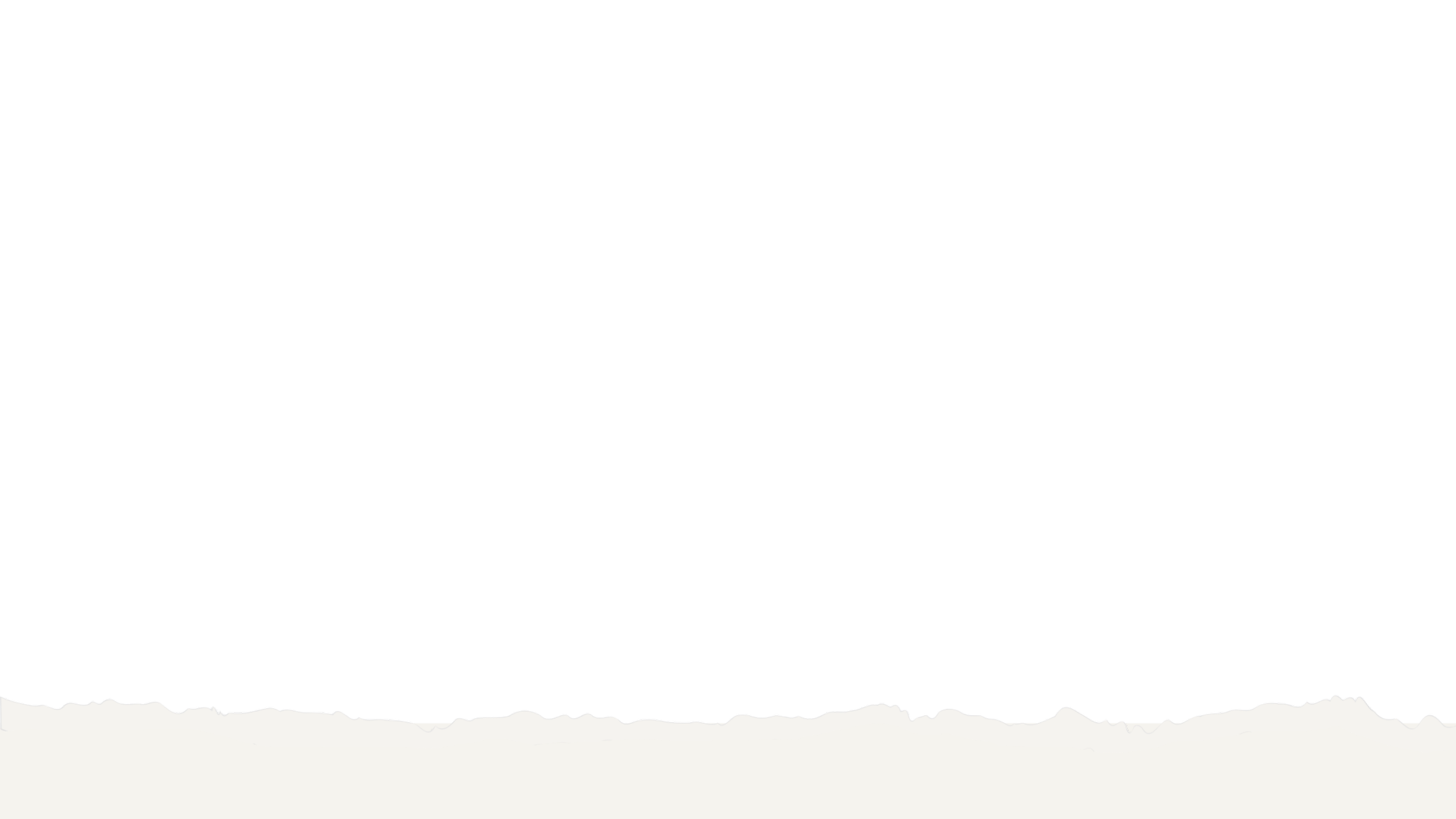 Black silhouette of a mountain range with a white torn paper-like border at the bottom.