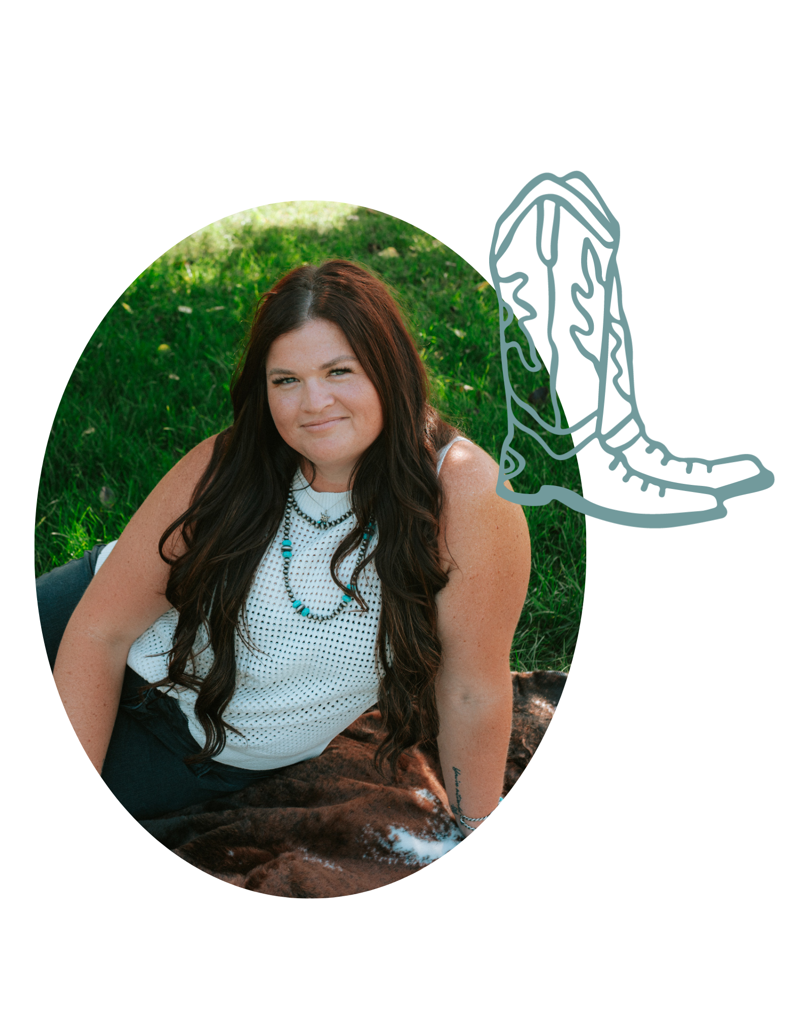 Ryann with long dark hair, wearing a white sleeveless top with a turquoise necklace, sitting on a blanket on green grass in sunlight.