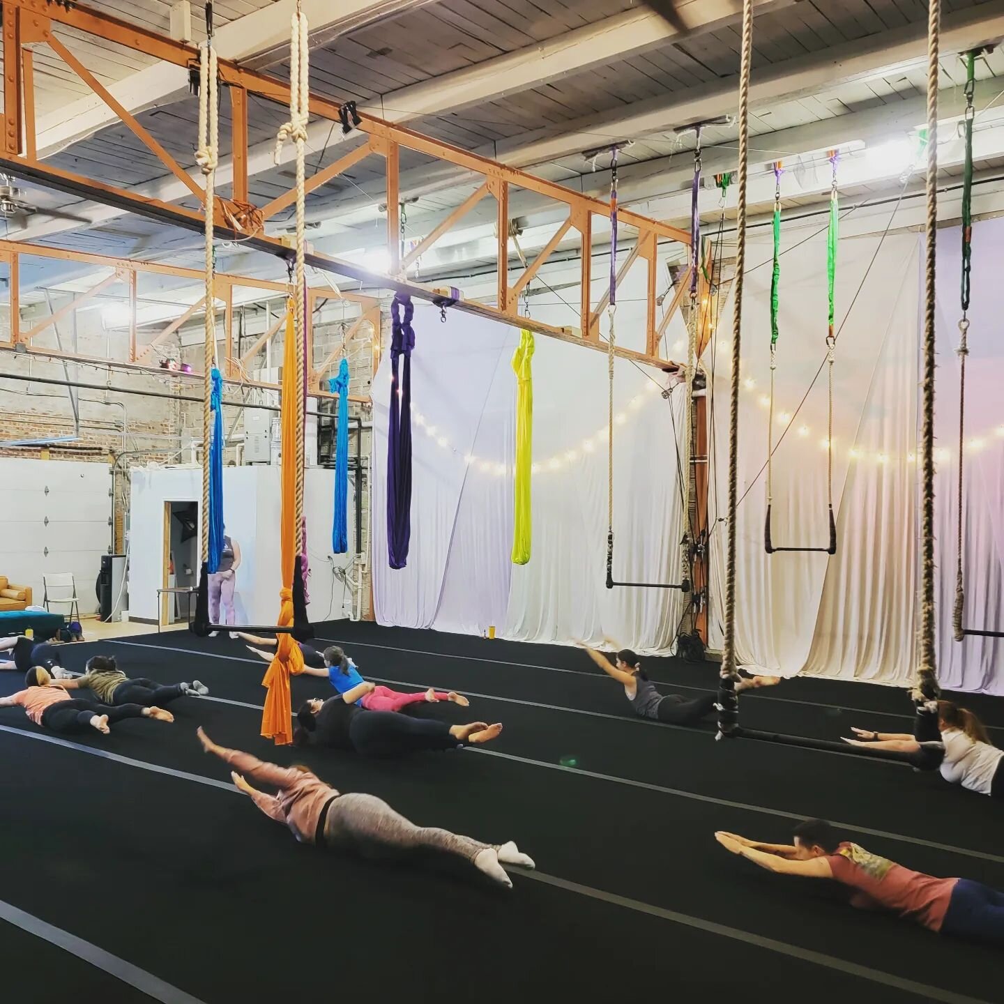 Sling and Bar 1 warming up together! Ever wonder what a trapeze or hoop class is like? Come join us for Bar 1 on Mondays at 6:30pm, Thursdays at 5:00pm, or Saturdays at 10:30am.