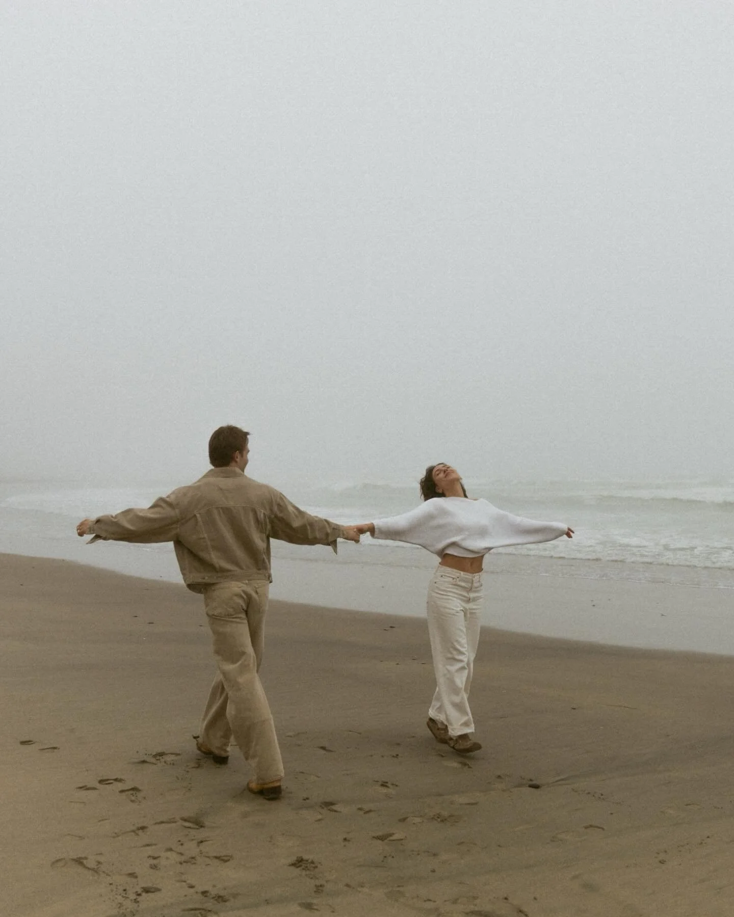 Dancing in the ocean fog 🩶 

It was the most beautiful and serene evening at Cape Kiwanda with Bradley &amp; Natalie. It had rained all day leading up to that evening. Slowly the drops turned to mist and the clouds began to lift. 

Birds soaring by,
