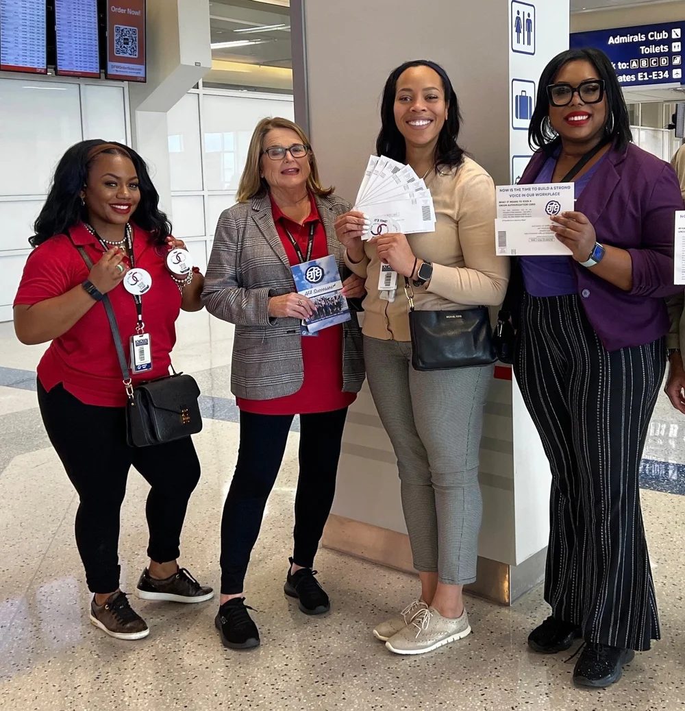 SkyWest Flight Attendants holding AFA authorization cards