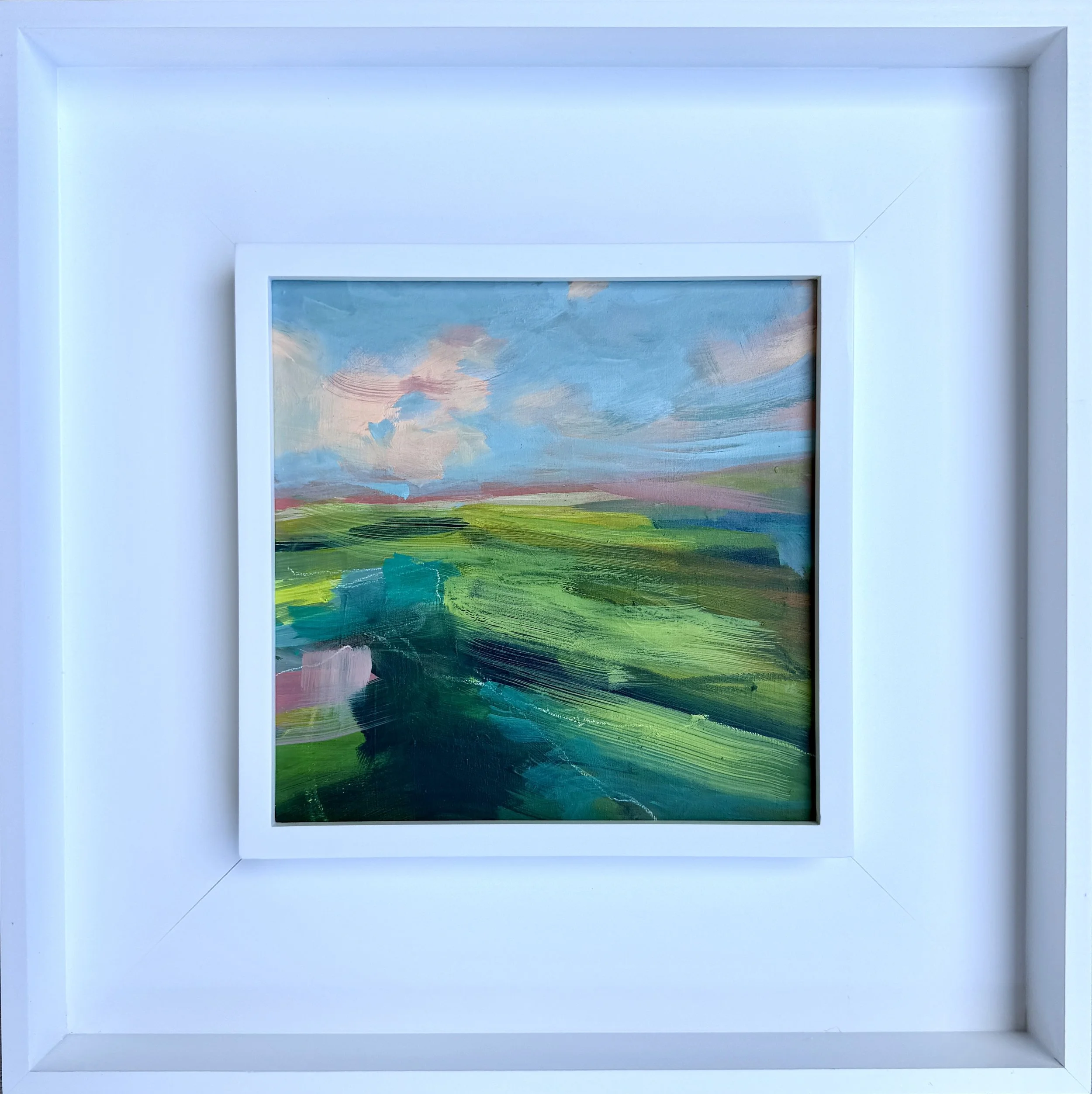 framed green landscape painting