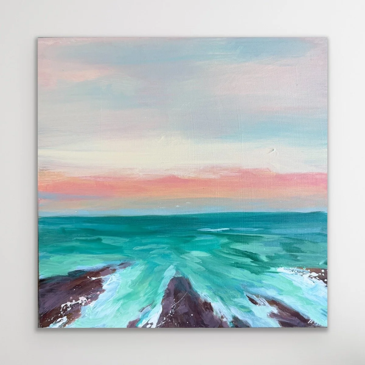 small ocean art with teal waters and pink horizon line