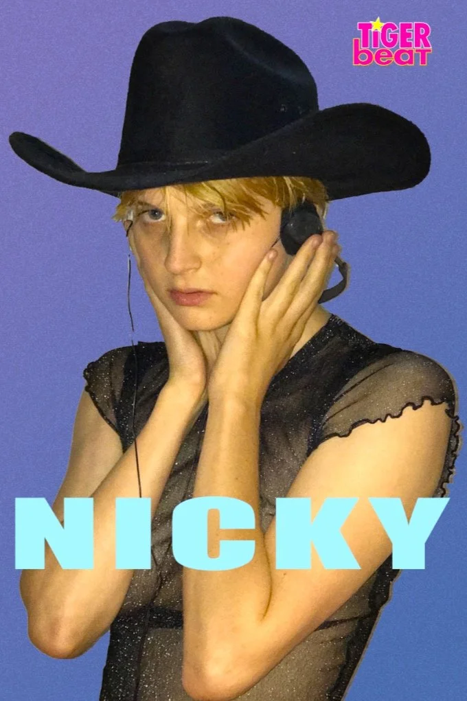 A person with blonde hair wearing a black cowboy hat and a sheer black top, holding a vintage telephone to their ear against a purple background. The image includes the text 'NICKY' in large light blue letters and the logo 'tiger beat' in pink and ye