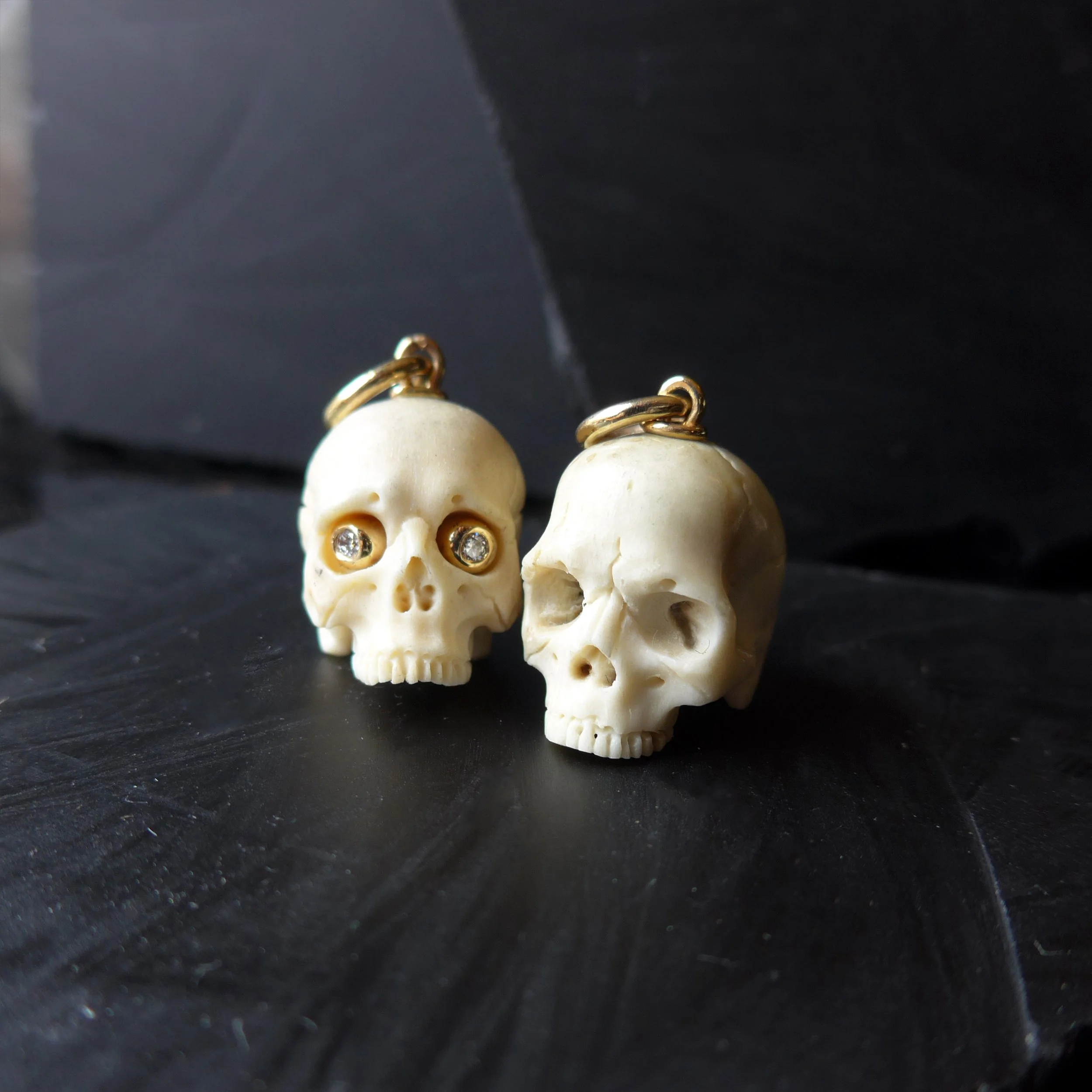 hand carved deer antler skull with 14k gold and diamond eyes