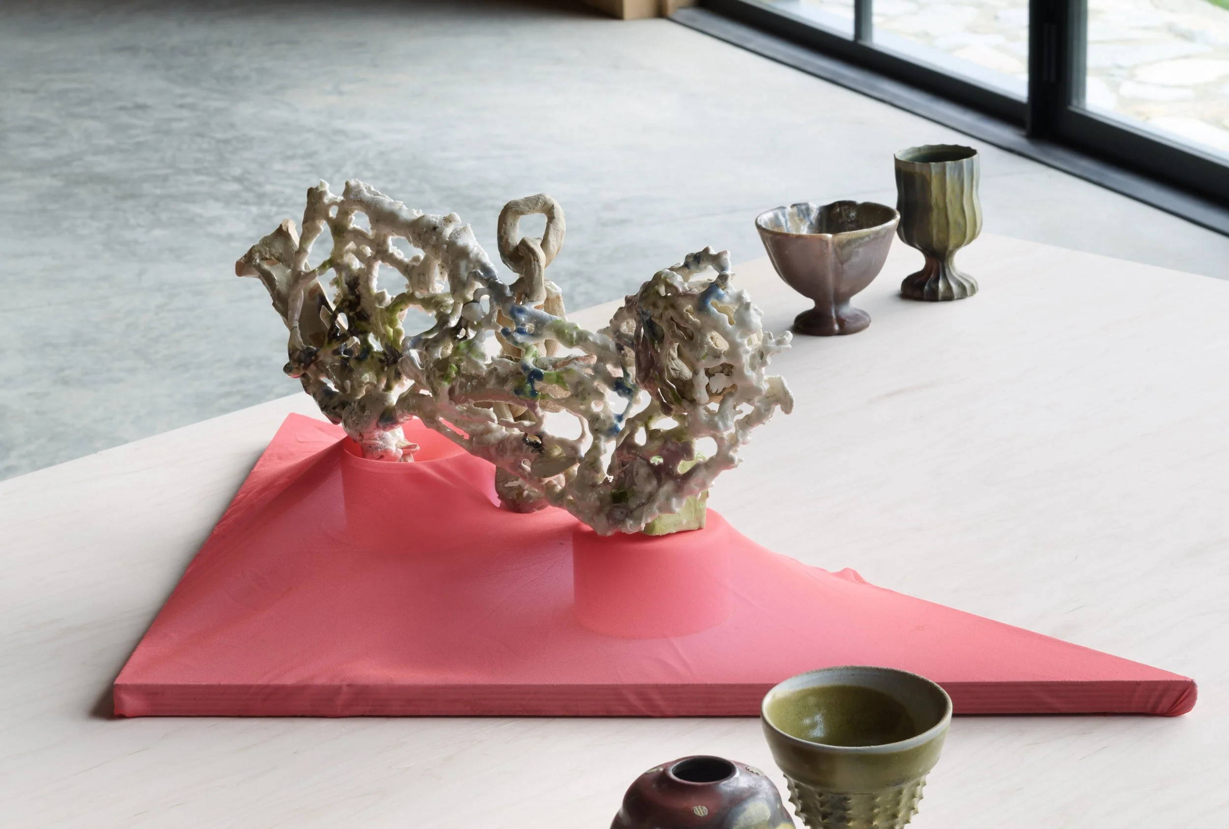 “The wind is moving towards–” ceramic slip casted hand sewn net, stoneware, glaze, wood, fabric, 2026