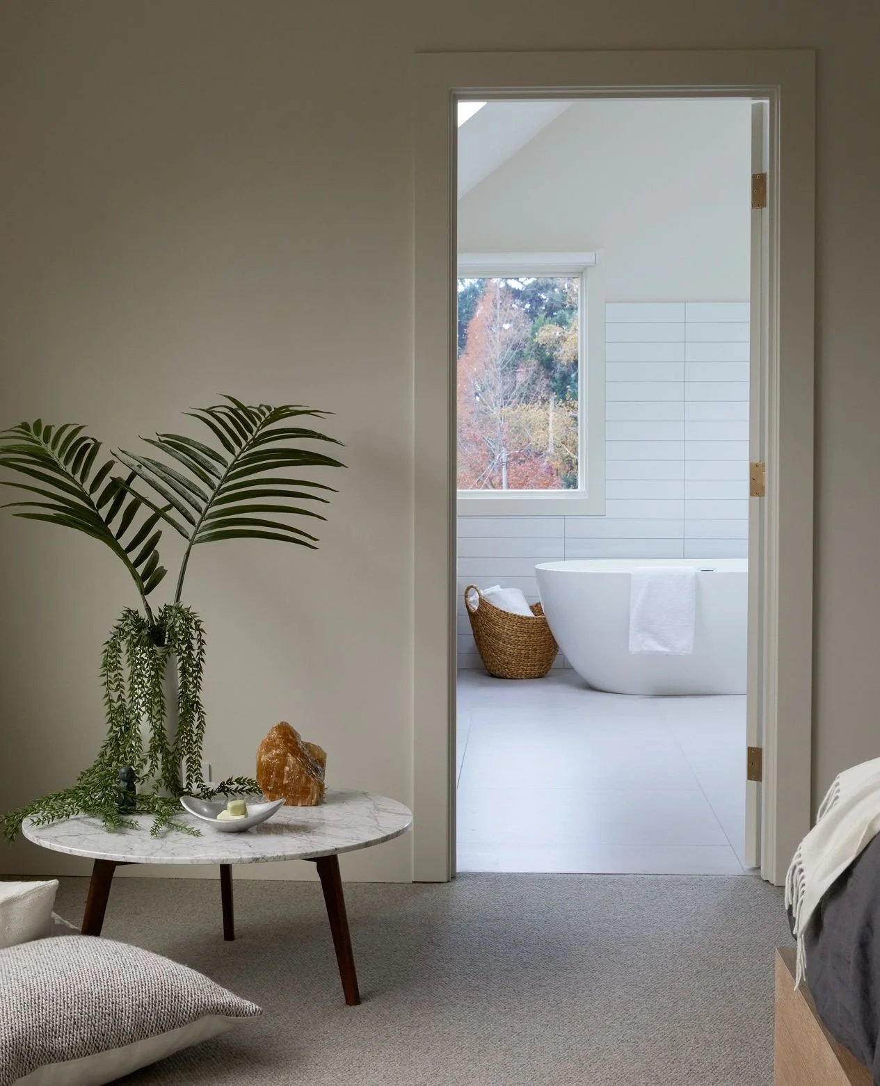 Filtered daylight fills this Portland Alameda primary bath, carried through new skylights and windows across white tile and painted walls.⁠
Swipe to the main-floor powder room, where the palette softens and the mood shifts.⁠
📸 @georgebarberis