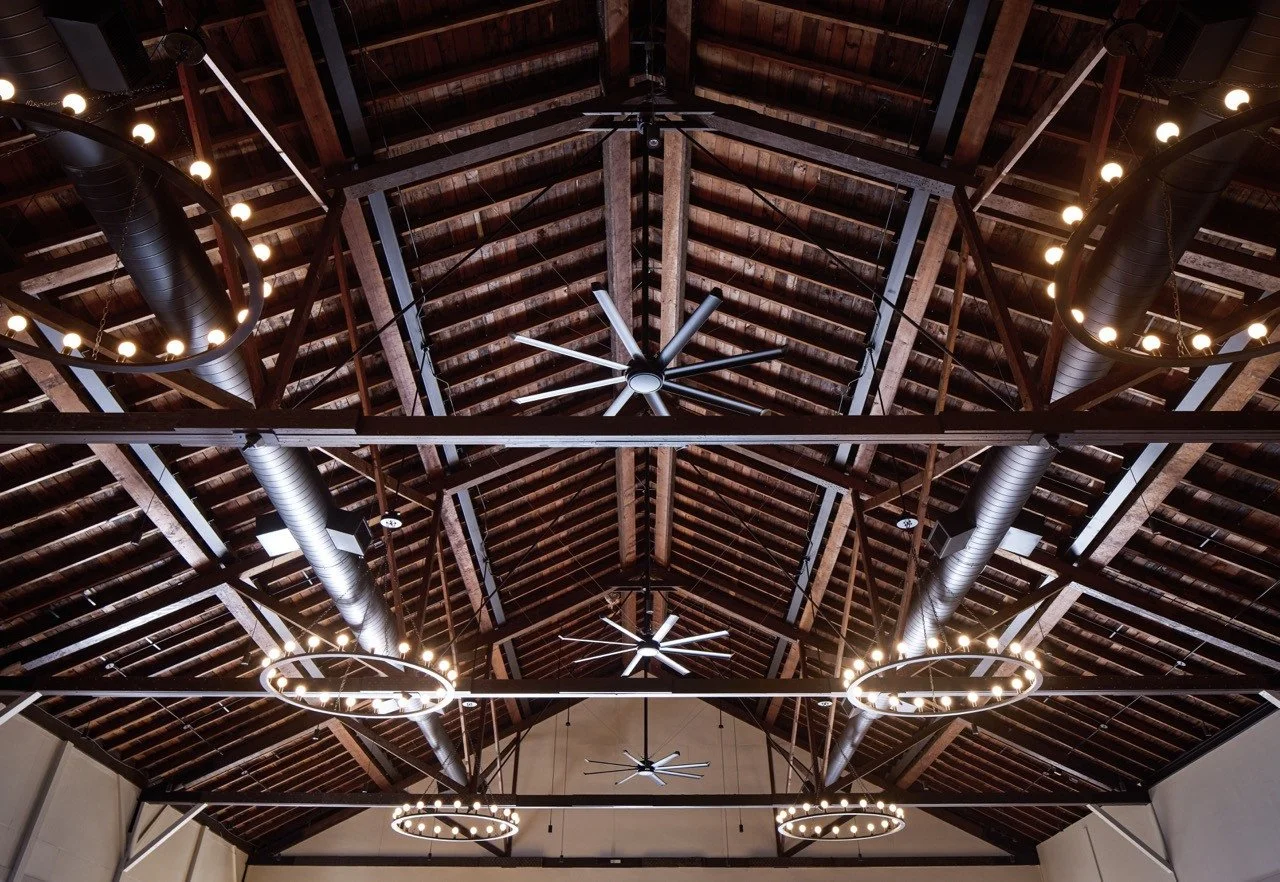 A lot of the work at Oaks Park Dance Pavilion was above our heads.⁠
⁠
With the drop ceiling removed, the original wood ceiling and structural framework could finally be seen again. What came with that was extensive coordination behind the scenes&mdas