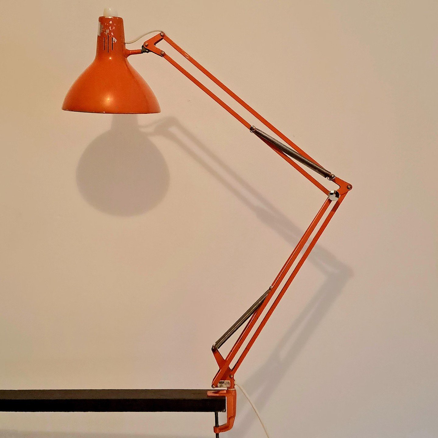 We all know this iconic vintage architectural clamp light.

For this tech office, we reworked that familiar form into a custom ceiling fixture composed of 10 of them. It is a simple move, but one that adds a sculptural, unexpected element to the spac