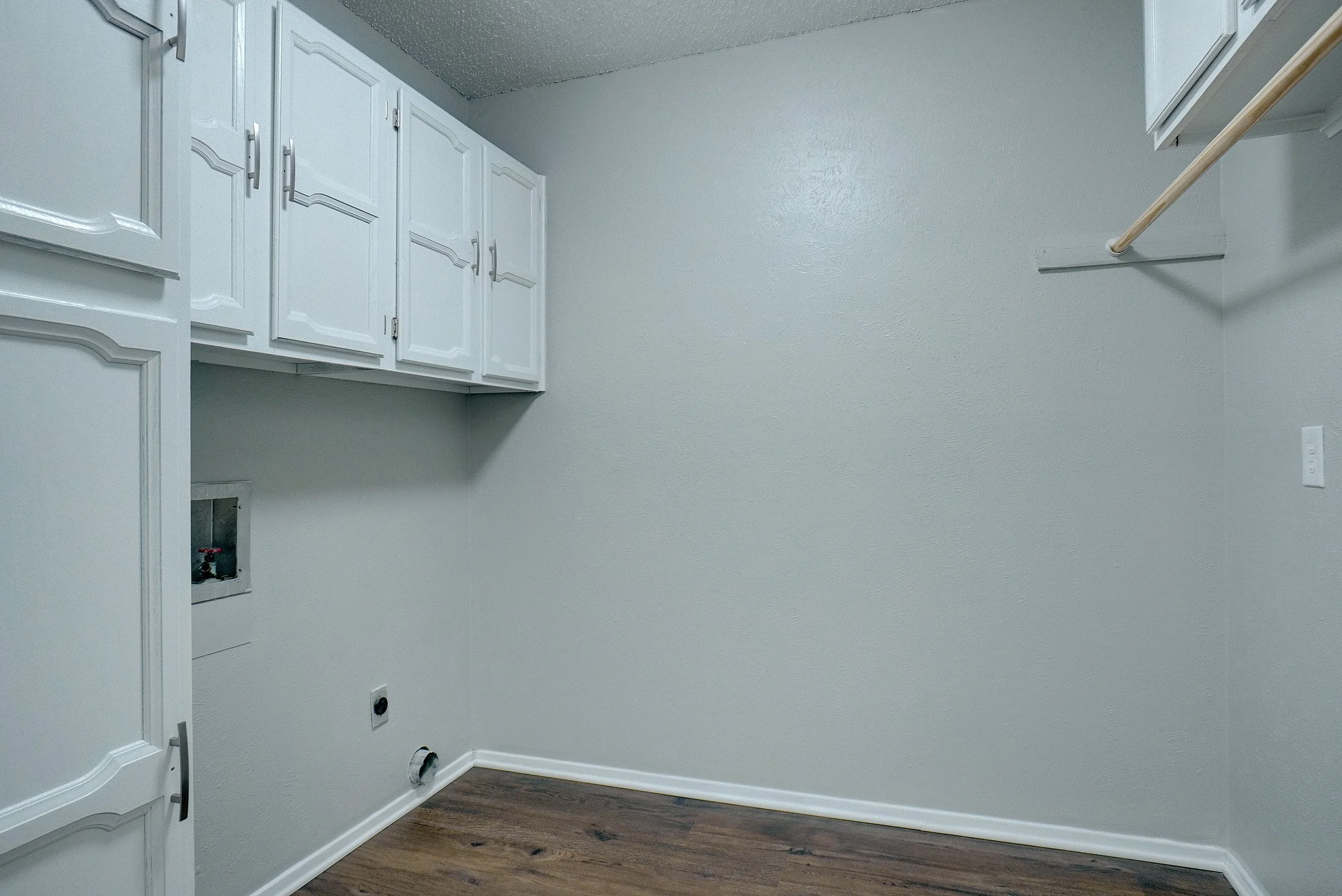Large laundry and pantry area with pocket door