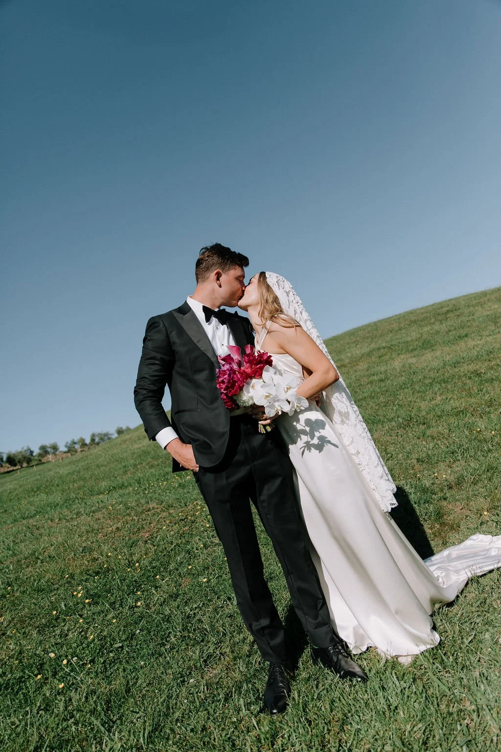 Beautiful Emily in L'eto gown and custom lace veil 