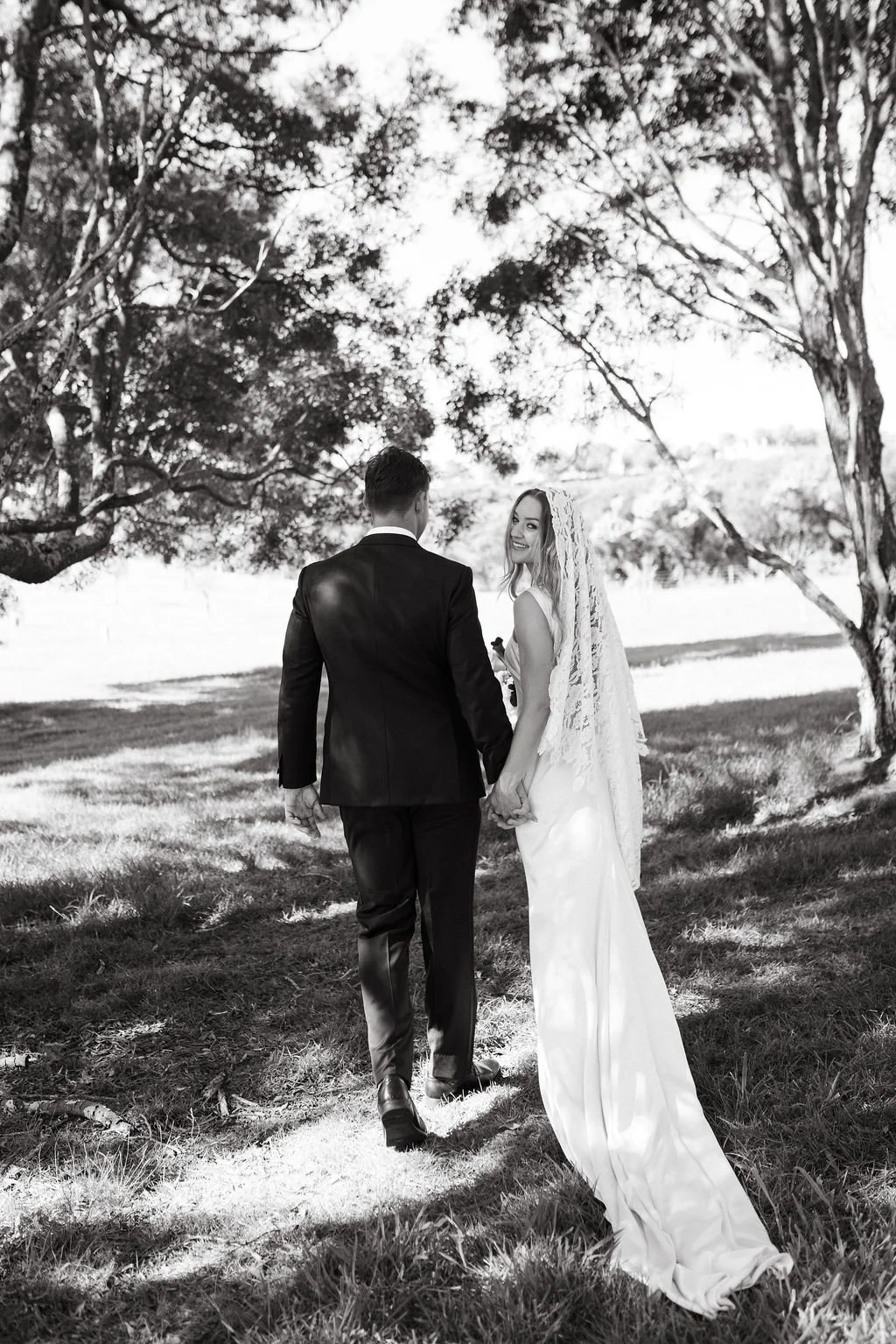 Beautiful Emily in L'eto gown and custom lace veil 
