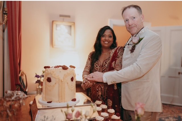 Couple cutting their bespoke wedding cake by My Heavenly Cakes Cambridge