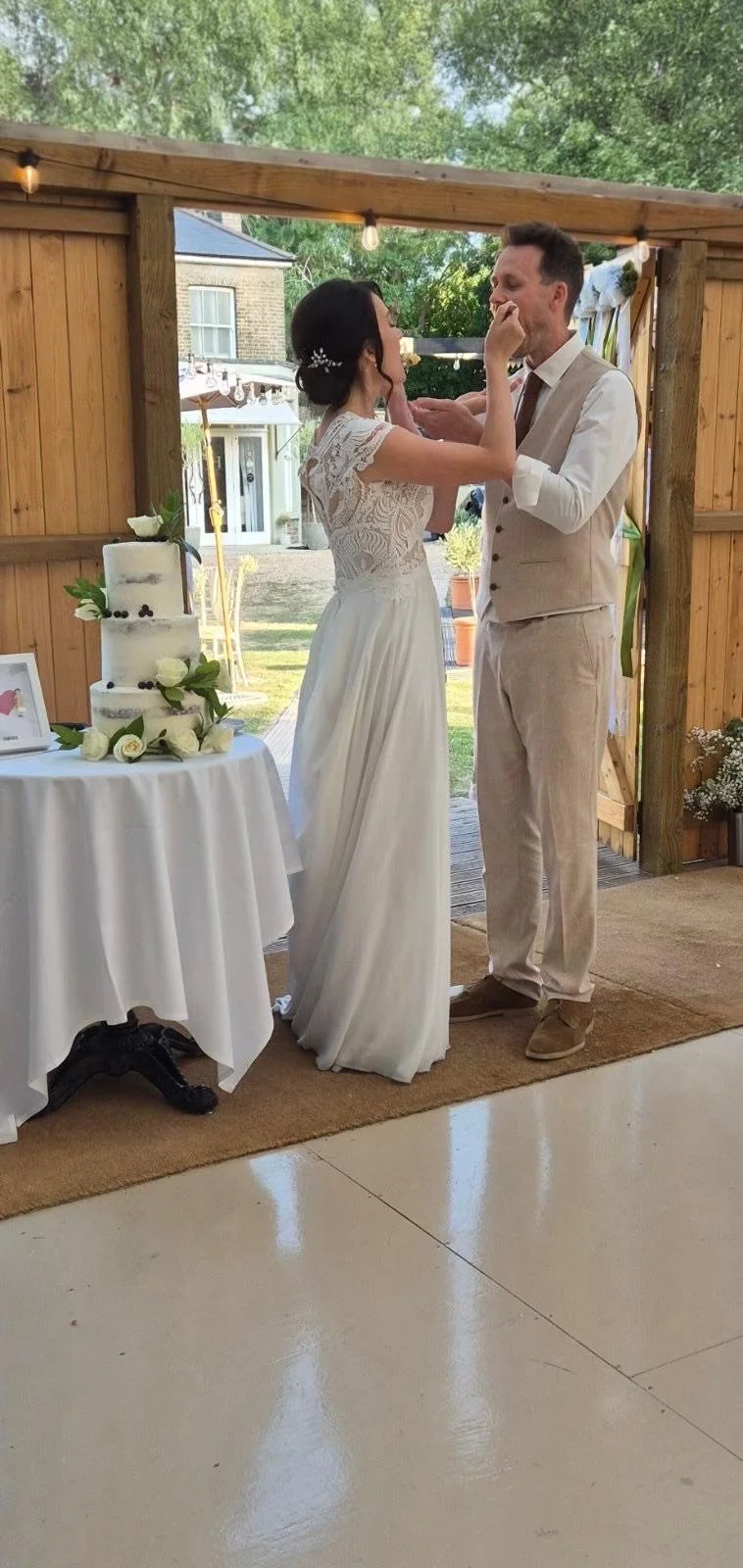 Couple enjoying their wedding cake together