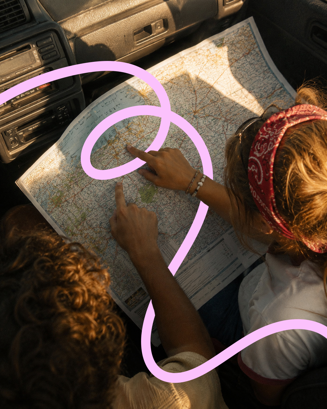 Two people studying a large map in a vehicle, with one pointing at a location and the other looking on, illuminated by warm sunlight, with purple decorative swirls overlayed.
