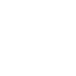A hand holding a small sprouting plant with two leaves.
