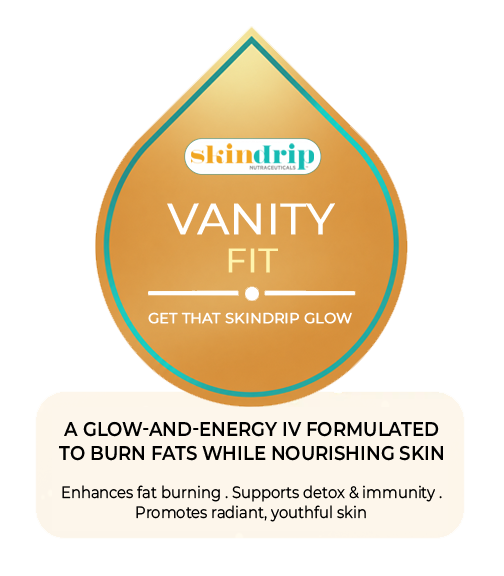 A skincare product named Vanity Glow in a silver tube with a gold label, surrounded by citrus fruits and green leaves, promoting whitening and vitamin boosting for visible skin repair-whitens, detox, and boost immunity and energy. 