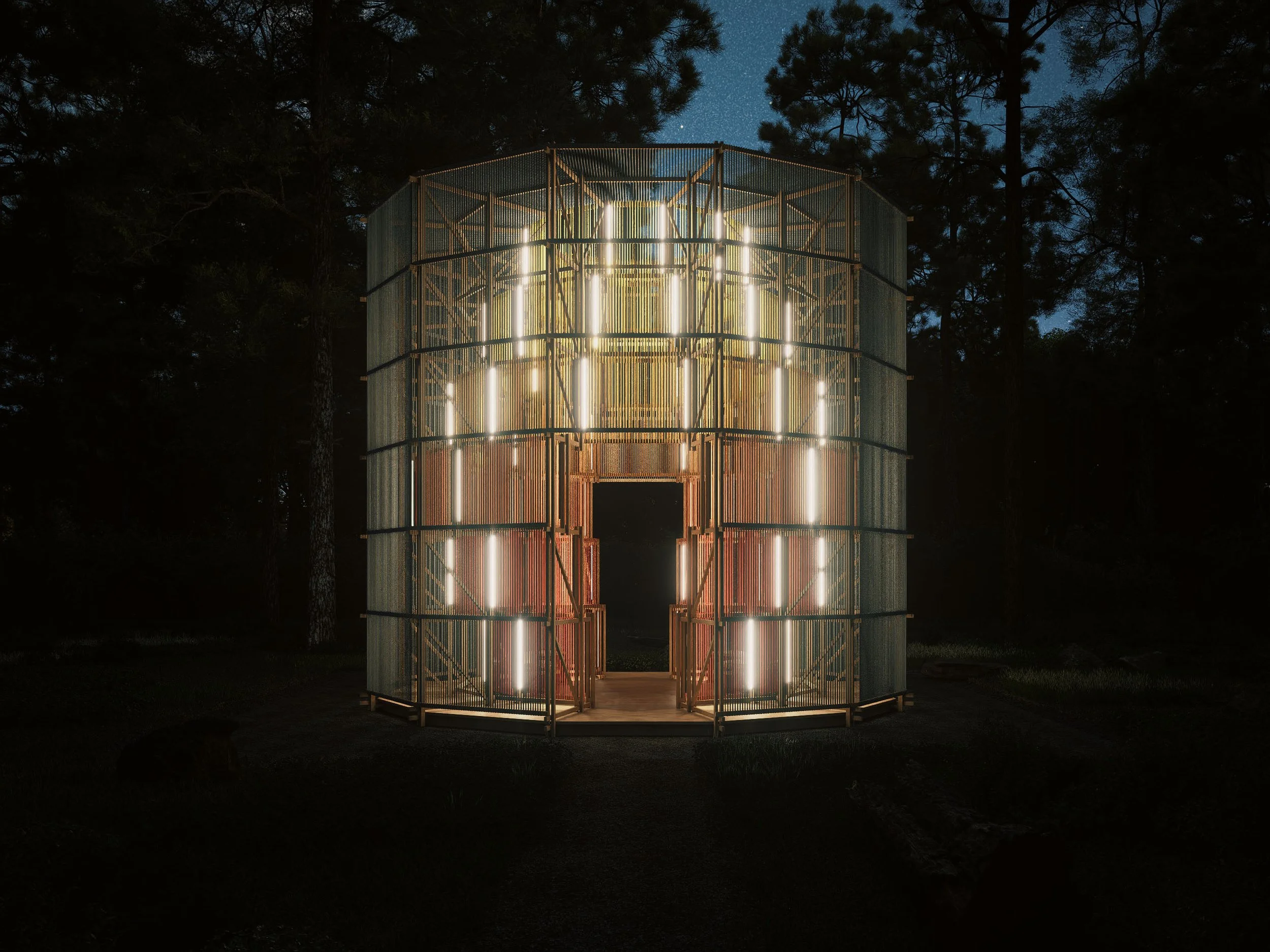 A modern, cylindrical structure made of metal with vertical light strips, illuminated at night in a forest setting.