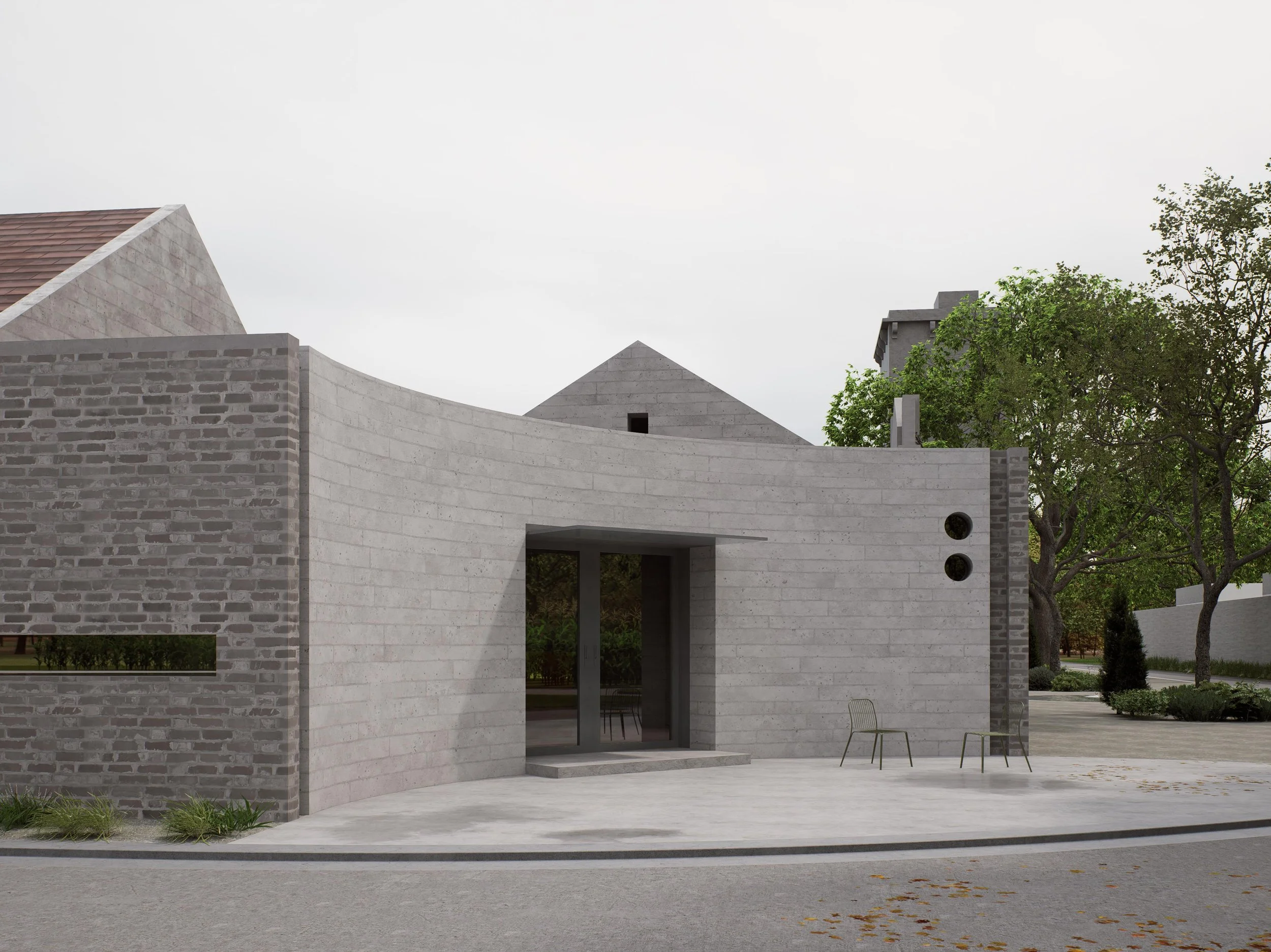 Modern building with curved concrete wall, brick accents, glass door, two chairs outside, trees and sidewalk.
