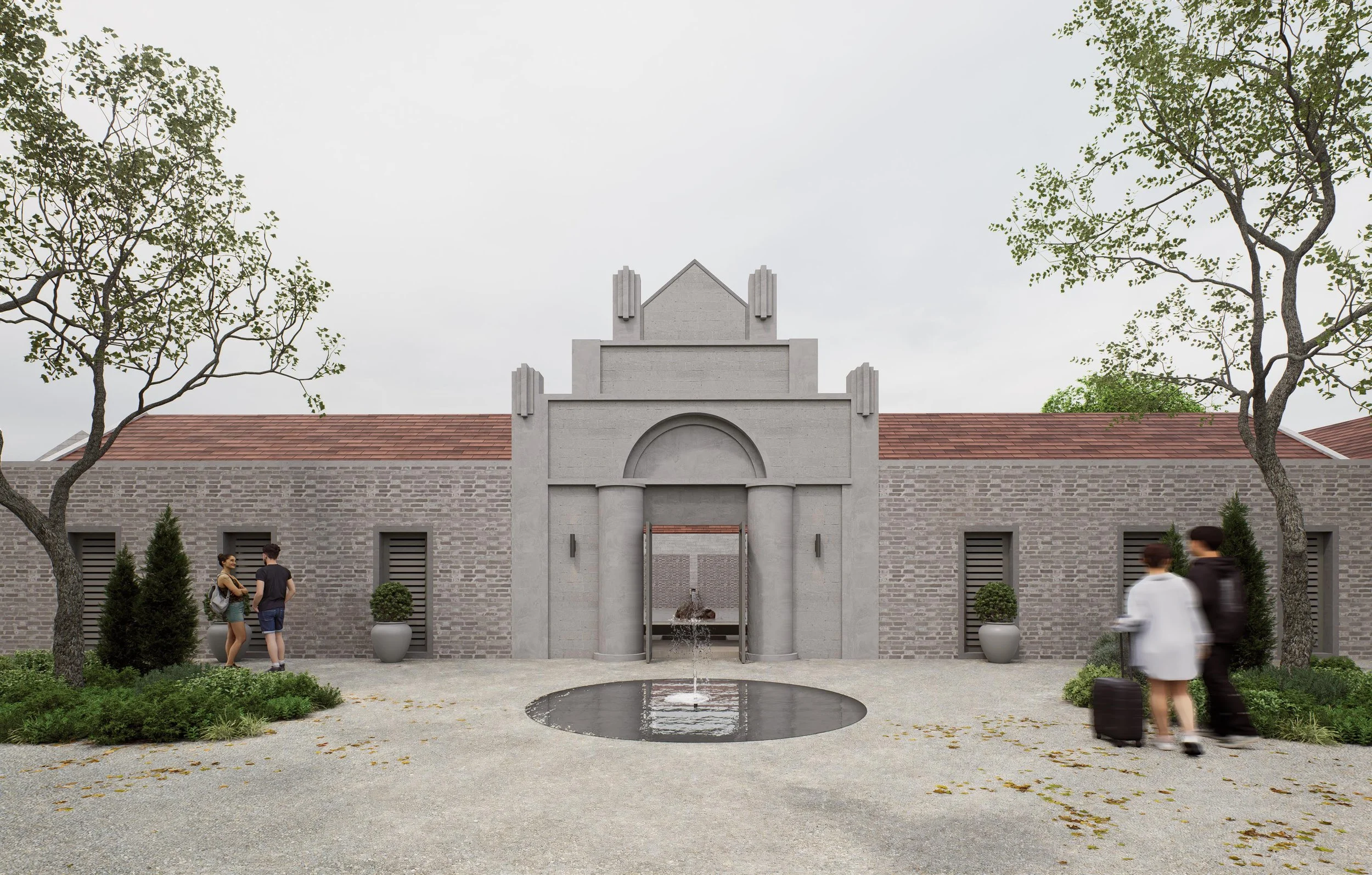 People walking and standing near the entrance of a building with a fountain in front, surrounded by trees and shrubs.