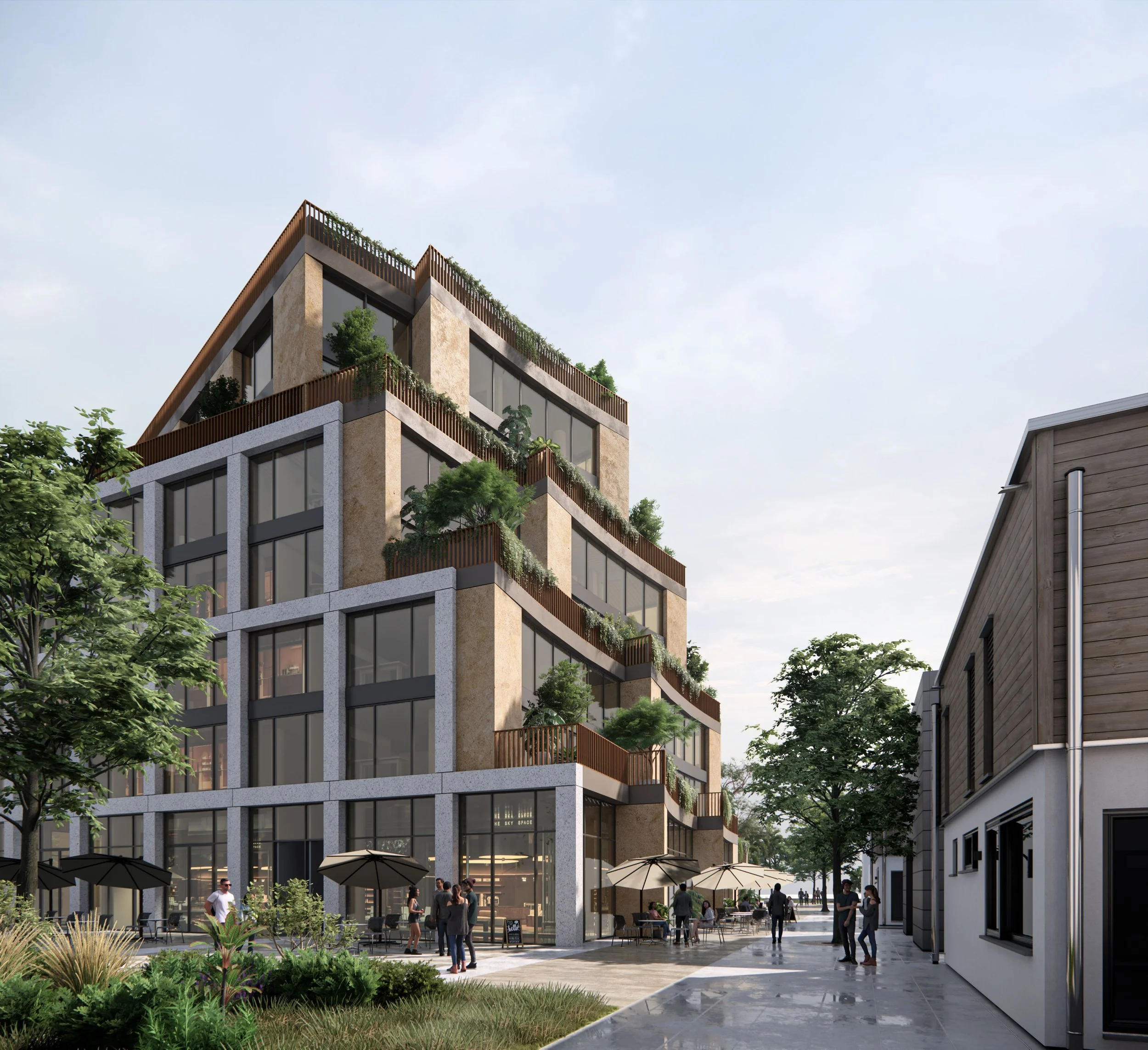 Modern multi-story building with large glass windows, rooftop gardens, and outdoor seating with umbrellas, situated on a pedestrian street with people walking and socializing.