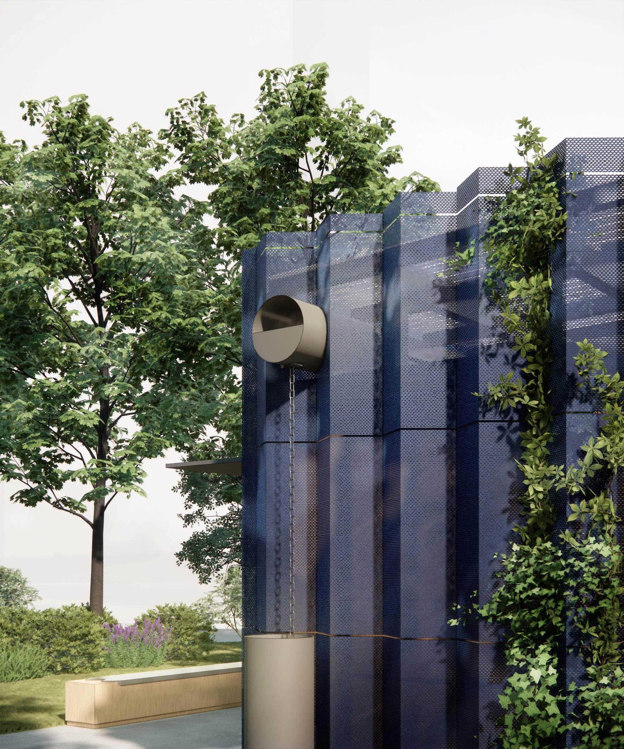 Modern architectural structure with a perforated blue metal facade, greenery growing on it, and a large cylindrical element with a chain hanging from it, set outdoors with trees and plants in the background.