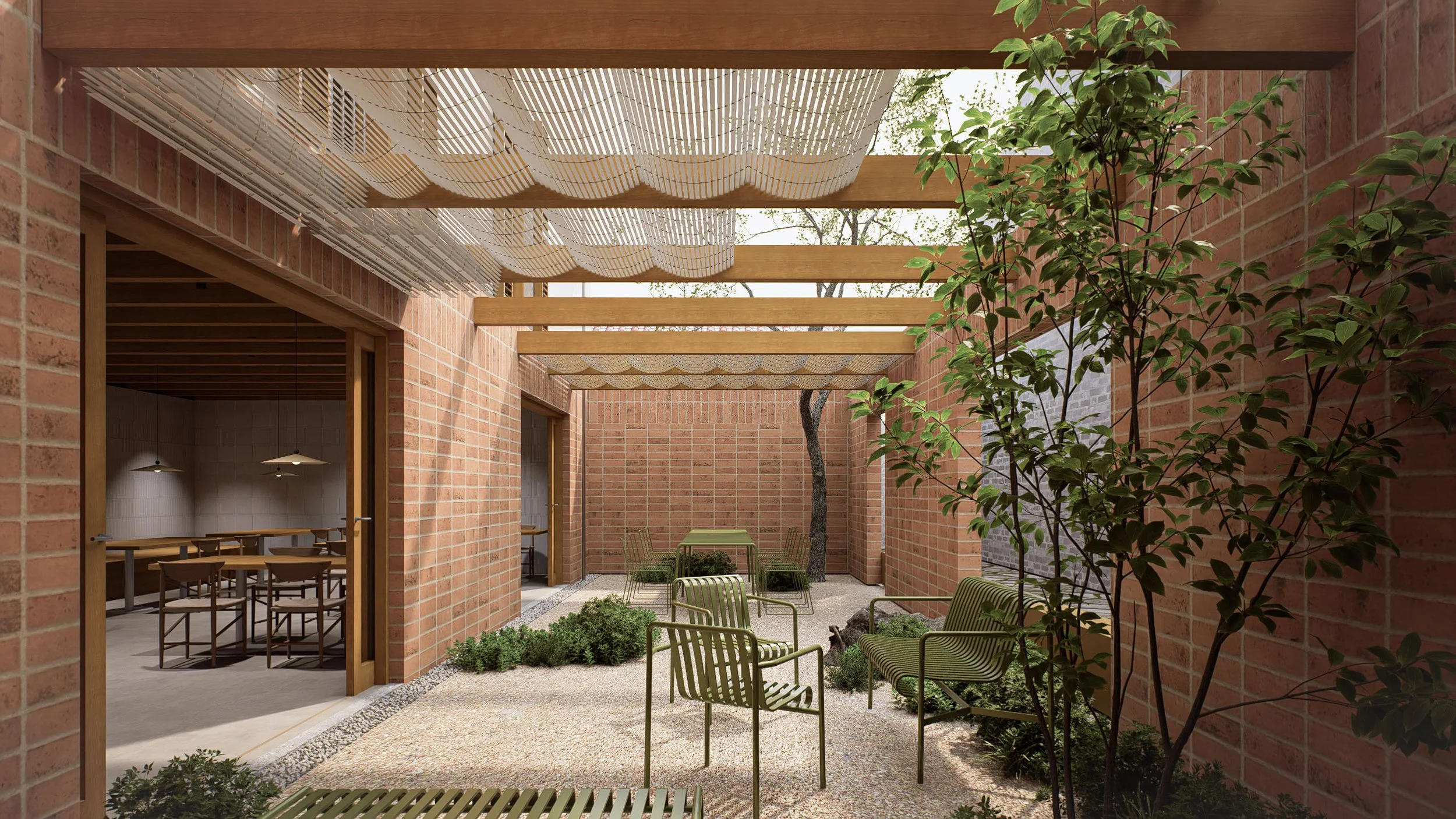 Outdoor courtyard with brick walls, green chairs and tables, small trees, and a pergola overhead.