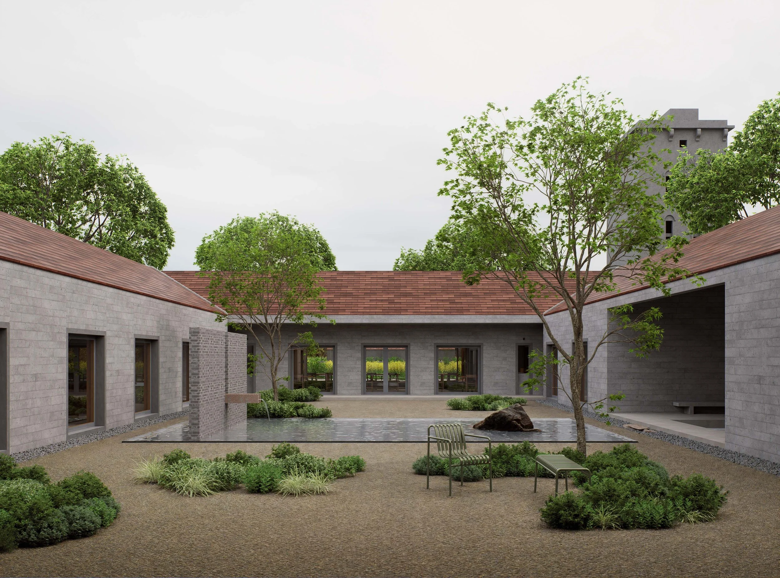 A modern courtyard with gray brick buildings, a water feature, trees, benches, and landscaped bushes.
