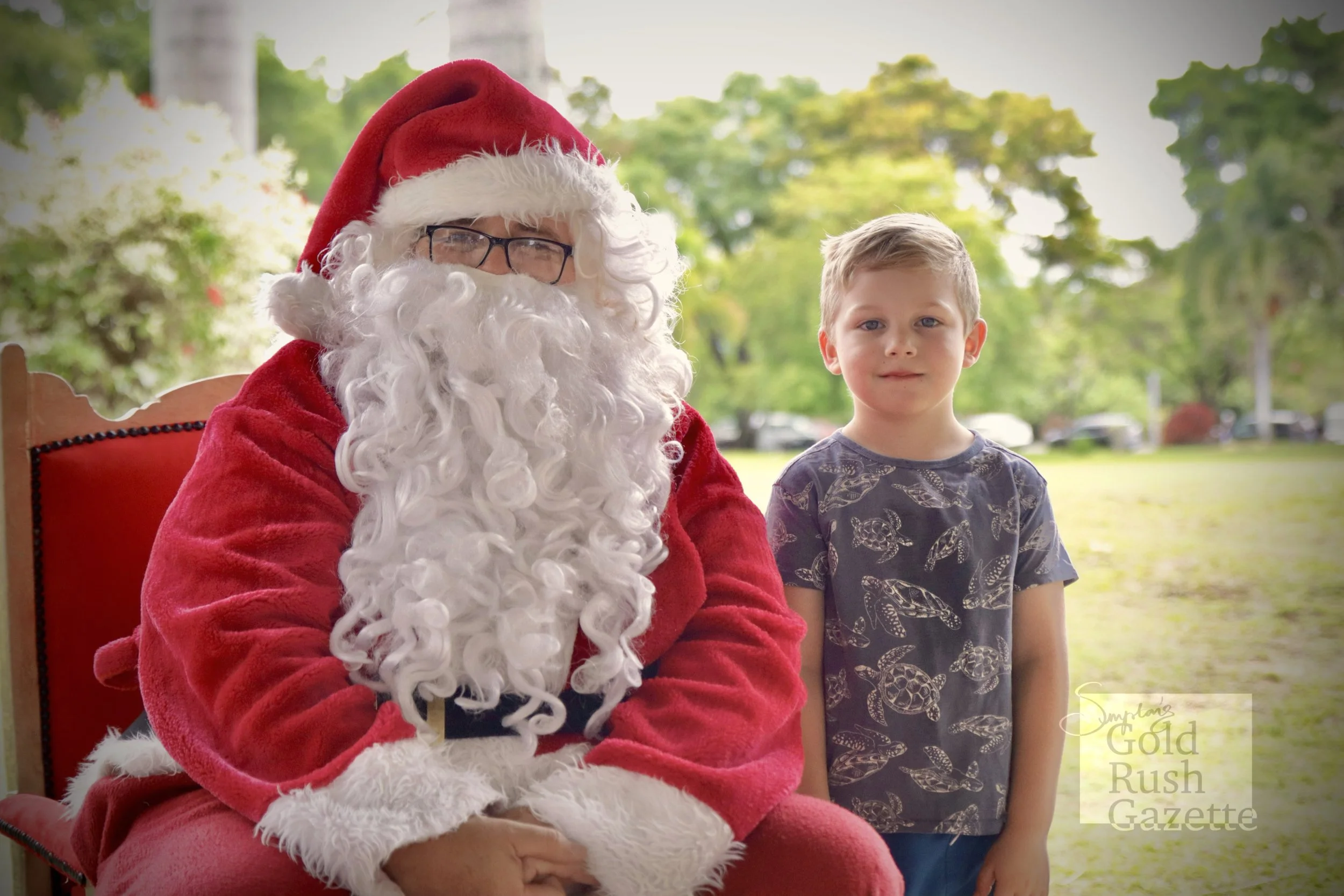 Photos with Santa at the Centenary Park Christmas Charity Markets hosted by Our Town Association Inc (2023)