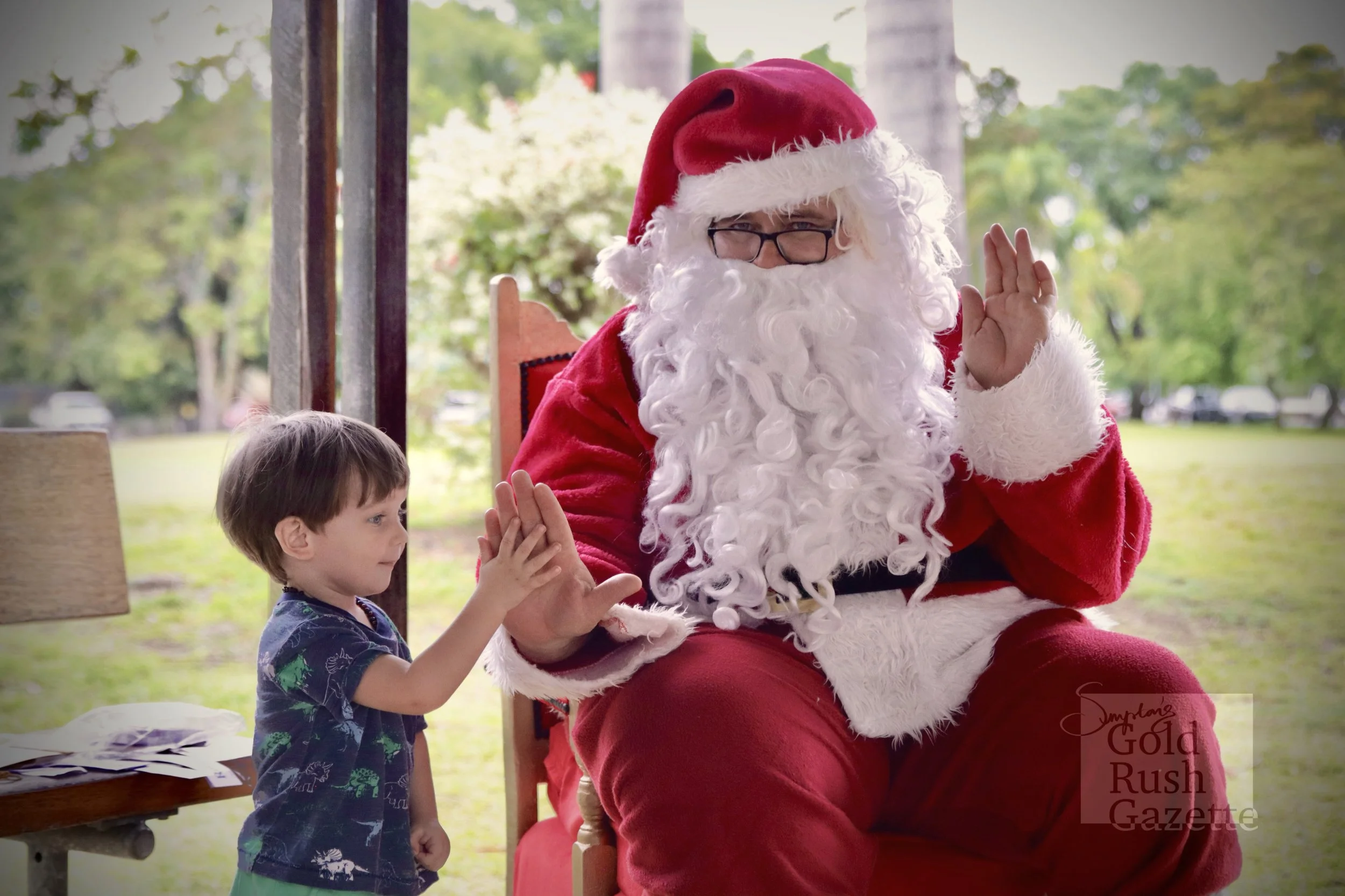 Photos with Santa at the Centenary Park Christmas Charity Markets hosted by Our Town Association Inc (2023)
