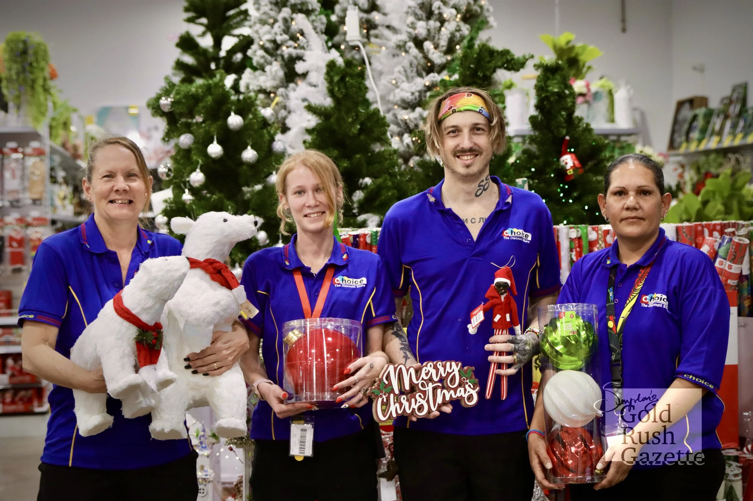 Marissa Clacy, Cait Webster, Staff member Kazimir Nikolaev, and Natasha Kyle with Christmas products at Choice the Discount Store within Goldtower Central (2024)