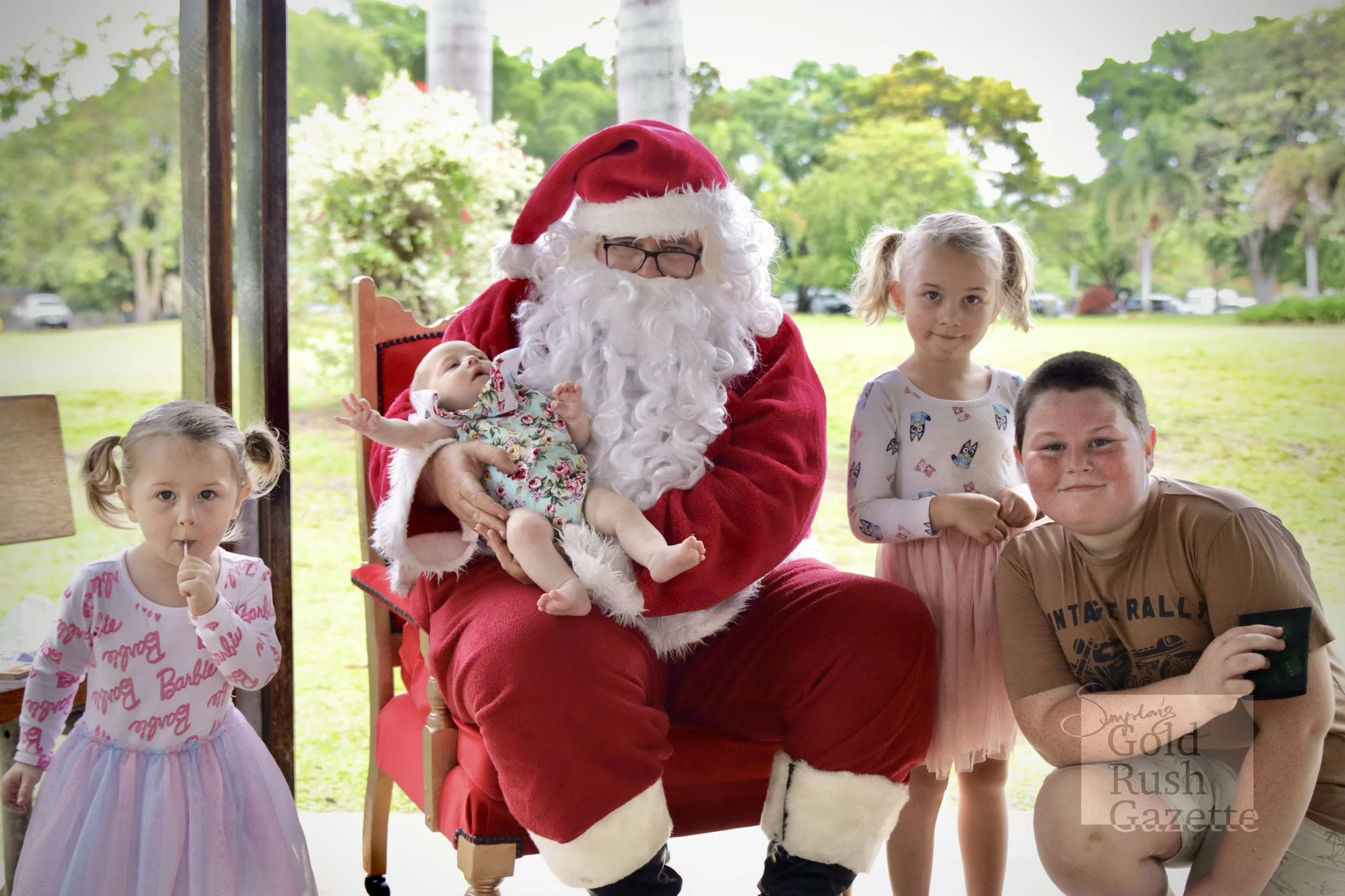 Photos with Santa at the Centenary Park Christmas Charity Markets hosted by Our Town Association Inc (2023)