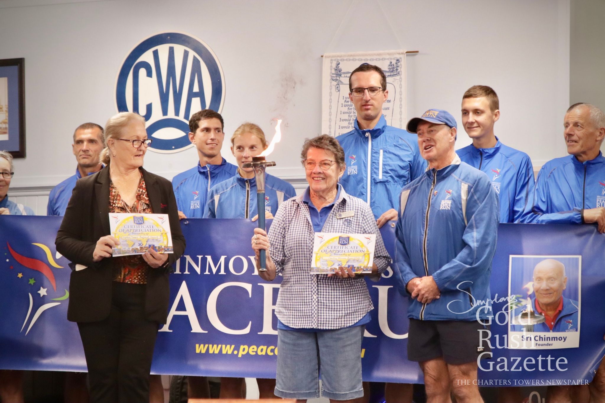 Peace Run participants, Mayor Liz Schmidt, and Gloria Battle at the Peace Run presentation event held at the CWA Hall (2025)