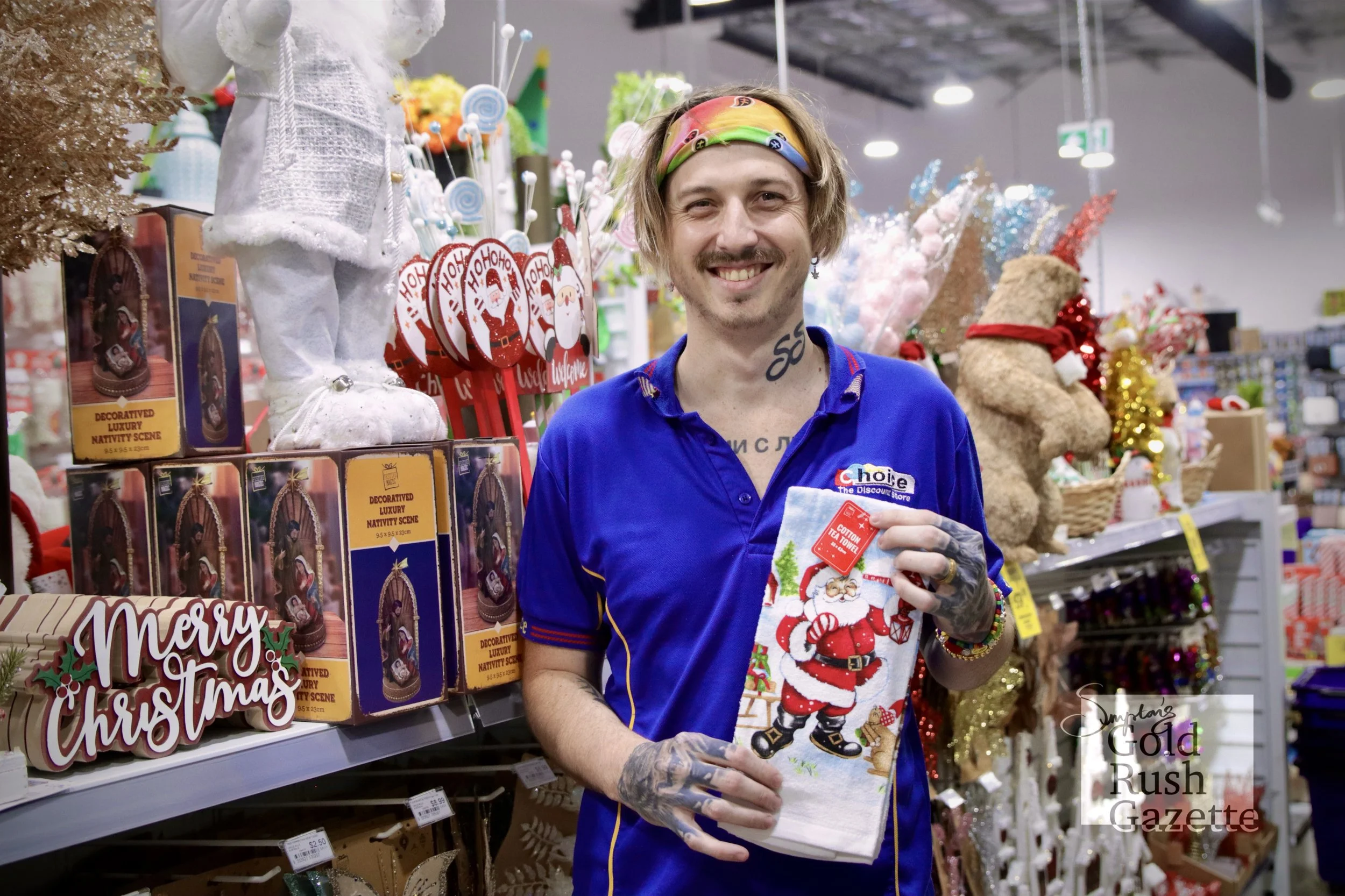 Staff member Kazimir Nikolaev with Christmas products at Choice the Discount Store within Goldtower Central (2024)