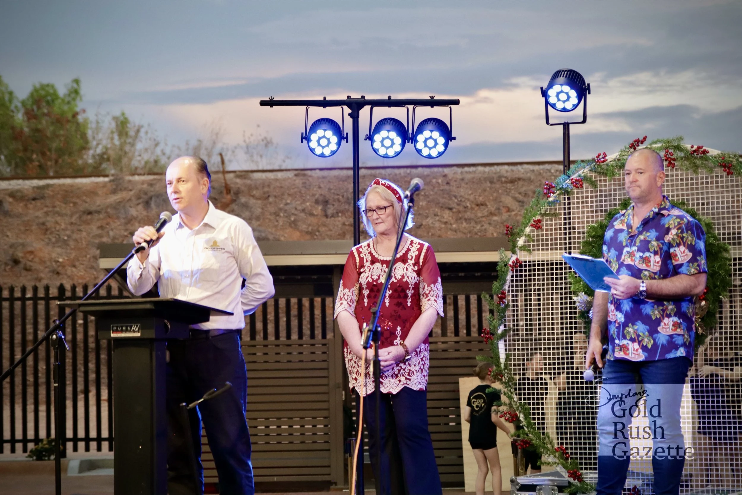 Paul Mciver, Mayor Liz Schmidt, and MC Jason Wolfgram at the Goldtower Christmas eat street markets at Poppet Head Plaza (2024)