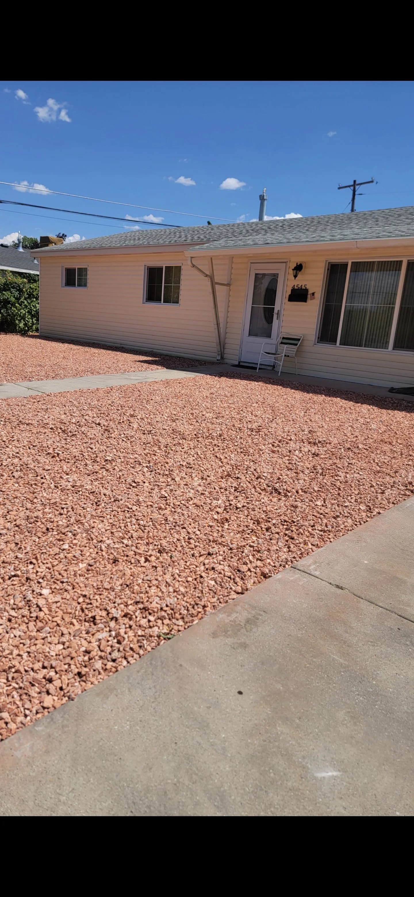 Landscaping and hardscape work completed by The Lazy Lawn for a Utah residential property in Davis County.