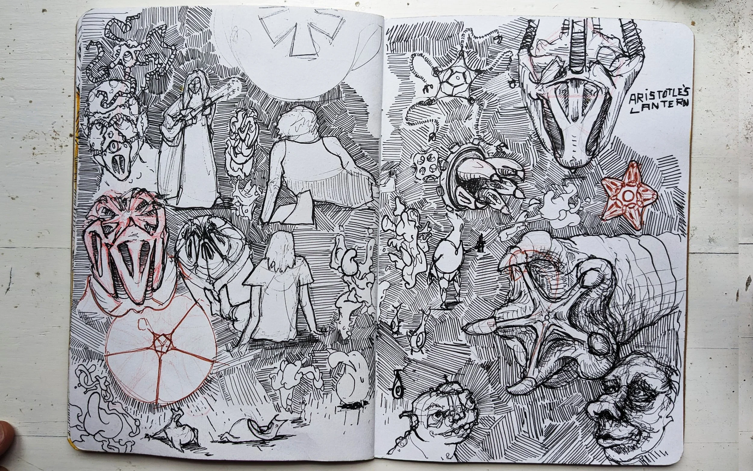 A black-and-white sketchbook spread with various surreal and abstract drawings. The left page features a girl playing a guitar, a person sitting with a backpack, and several fantastical faces with exaggerated features. The right page contains various