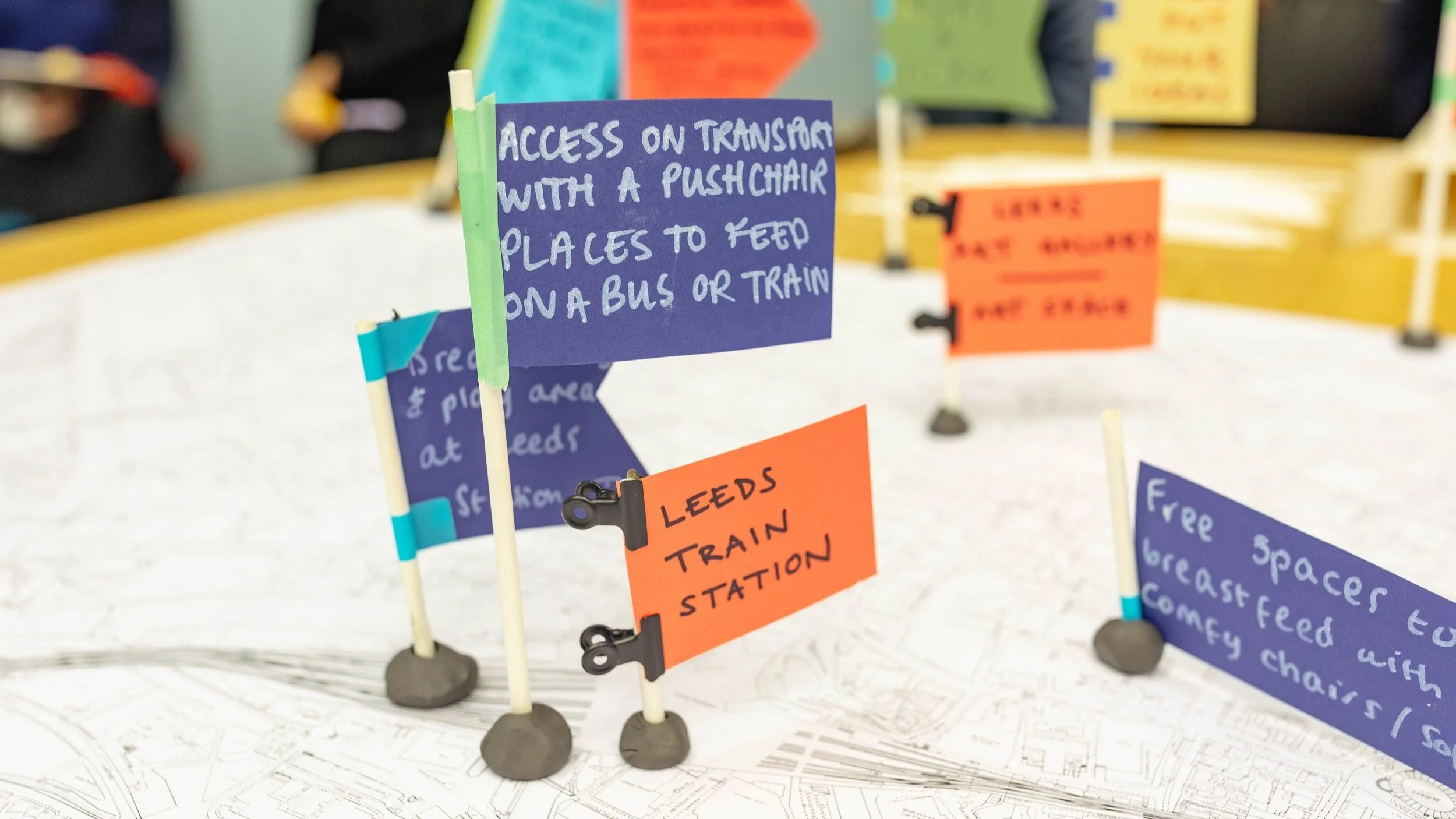 Colourful flags on a map.