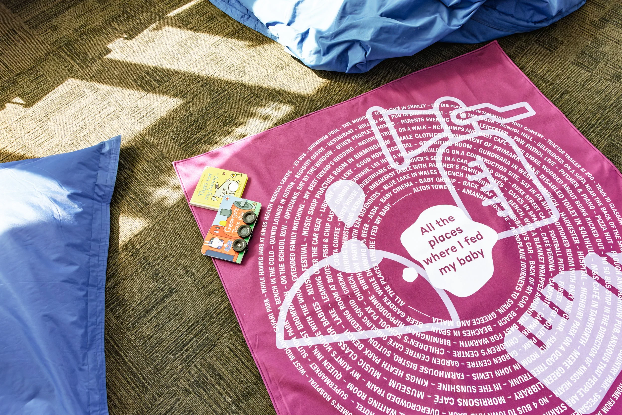 Picnic balnket printed with text 'All the places where I fed my baby'