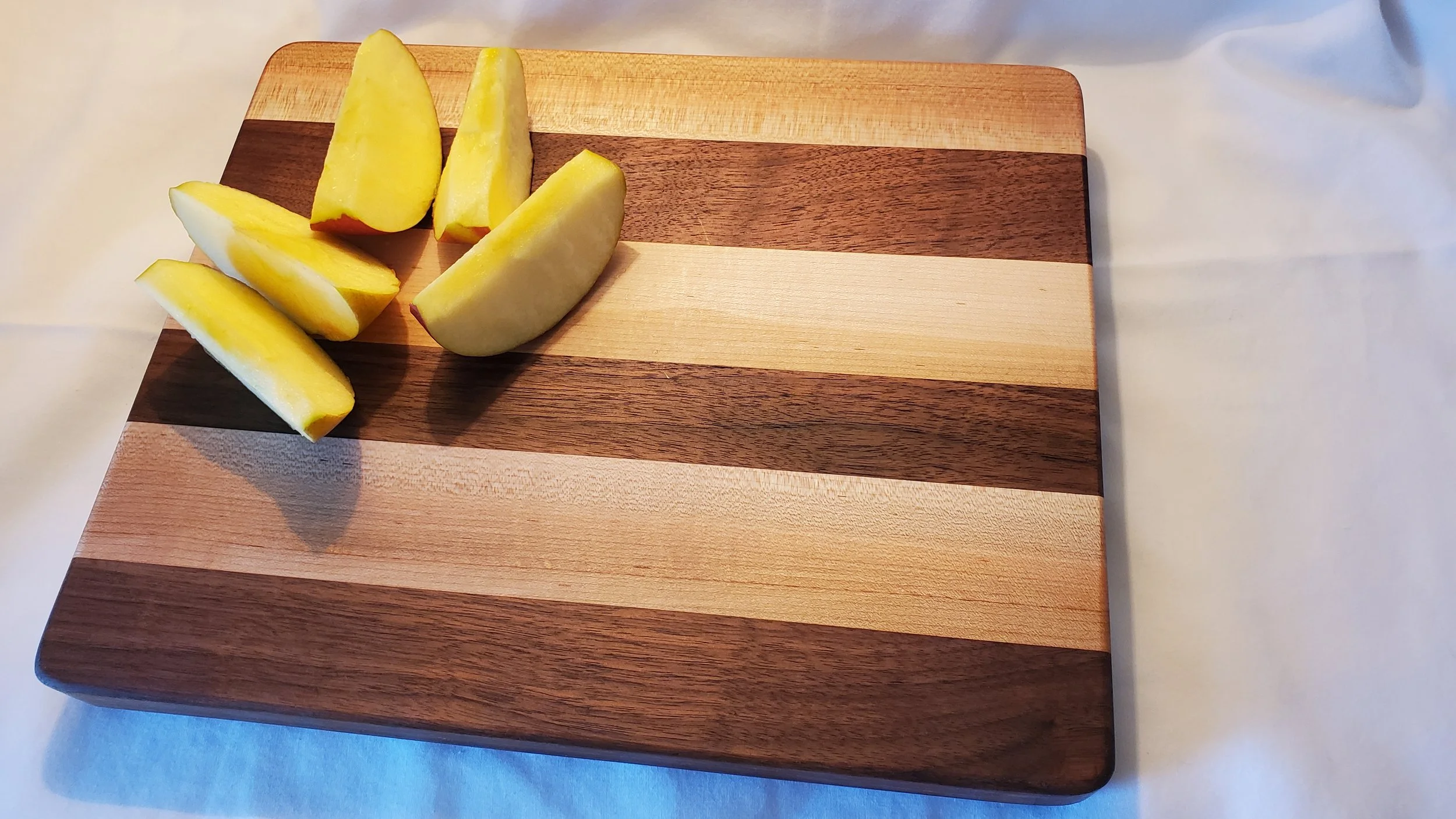 A Sandwich Size Cutting Board is 9.5 inch wide by 11.5 inch long 